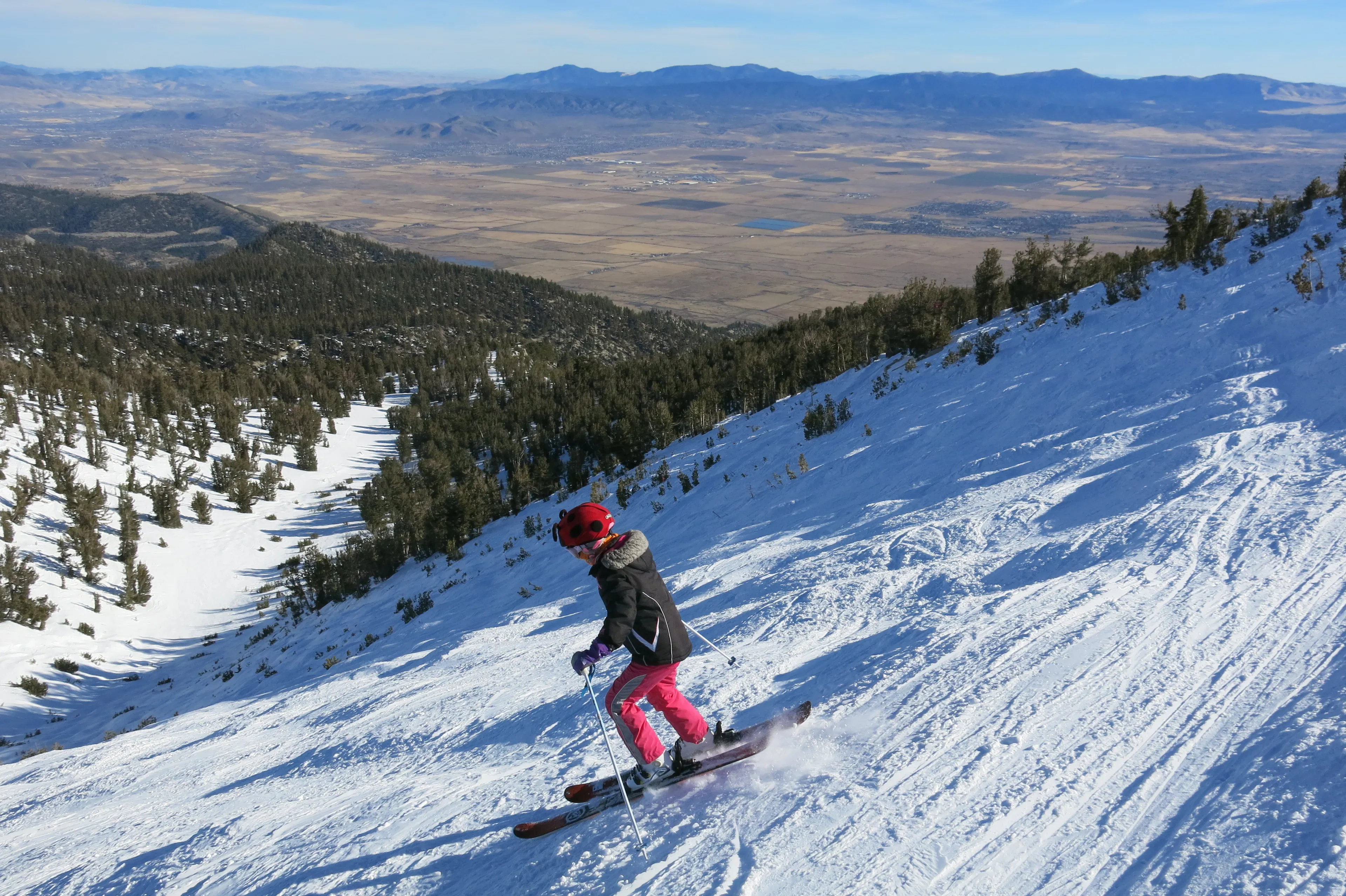 A kid skiing down a slope at Heavenly Ski Resort