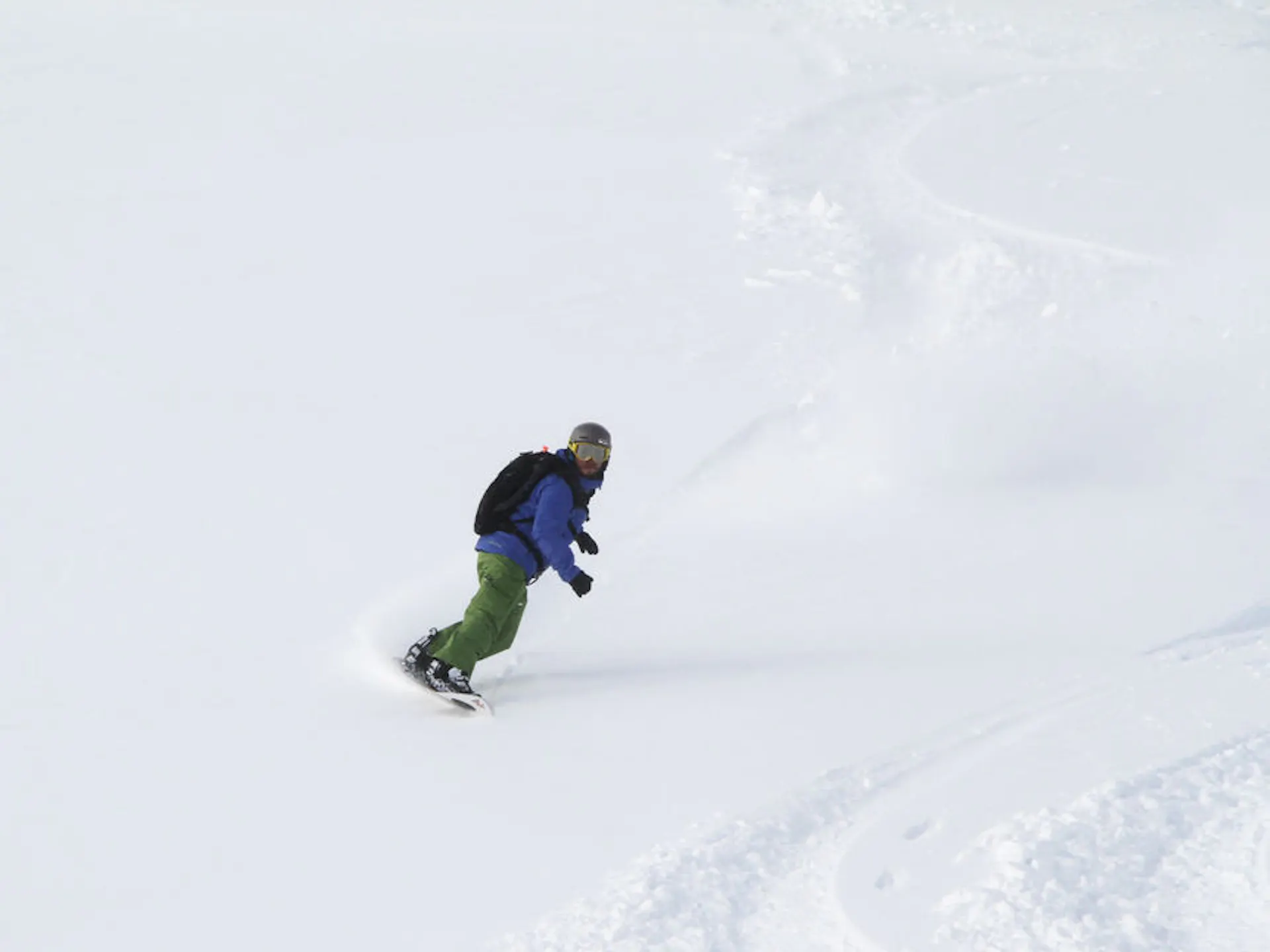 Snowboarding down a steep slope