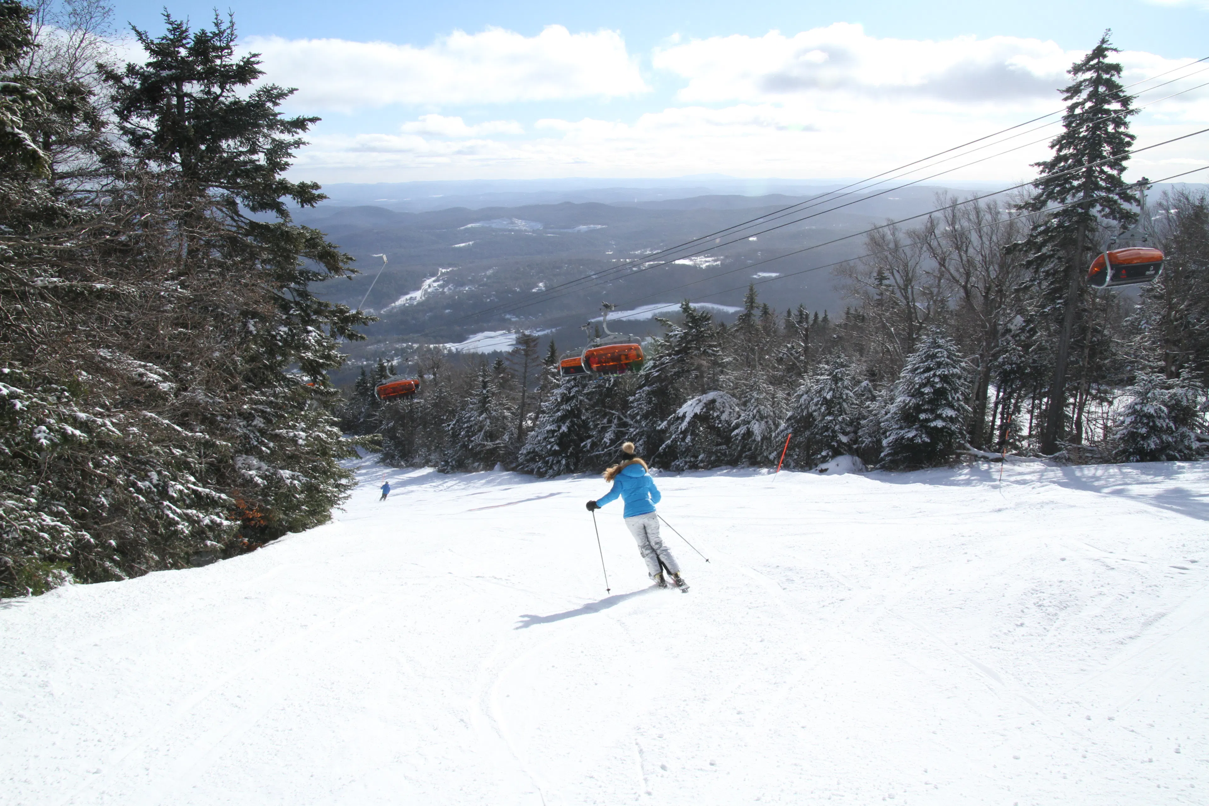 Skiing down Okemo Mountain Resort slope