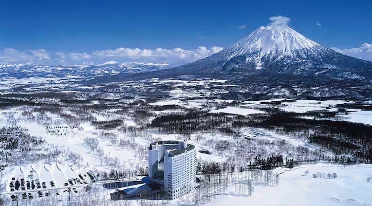 Aerial view of Niseko Village and Mount Yoyei covered in snow