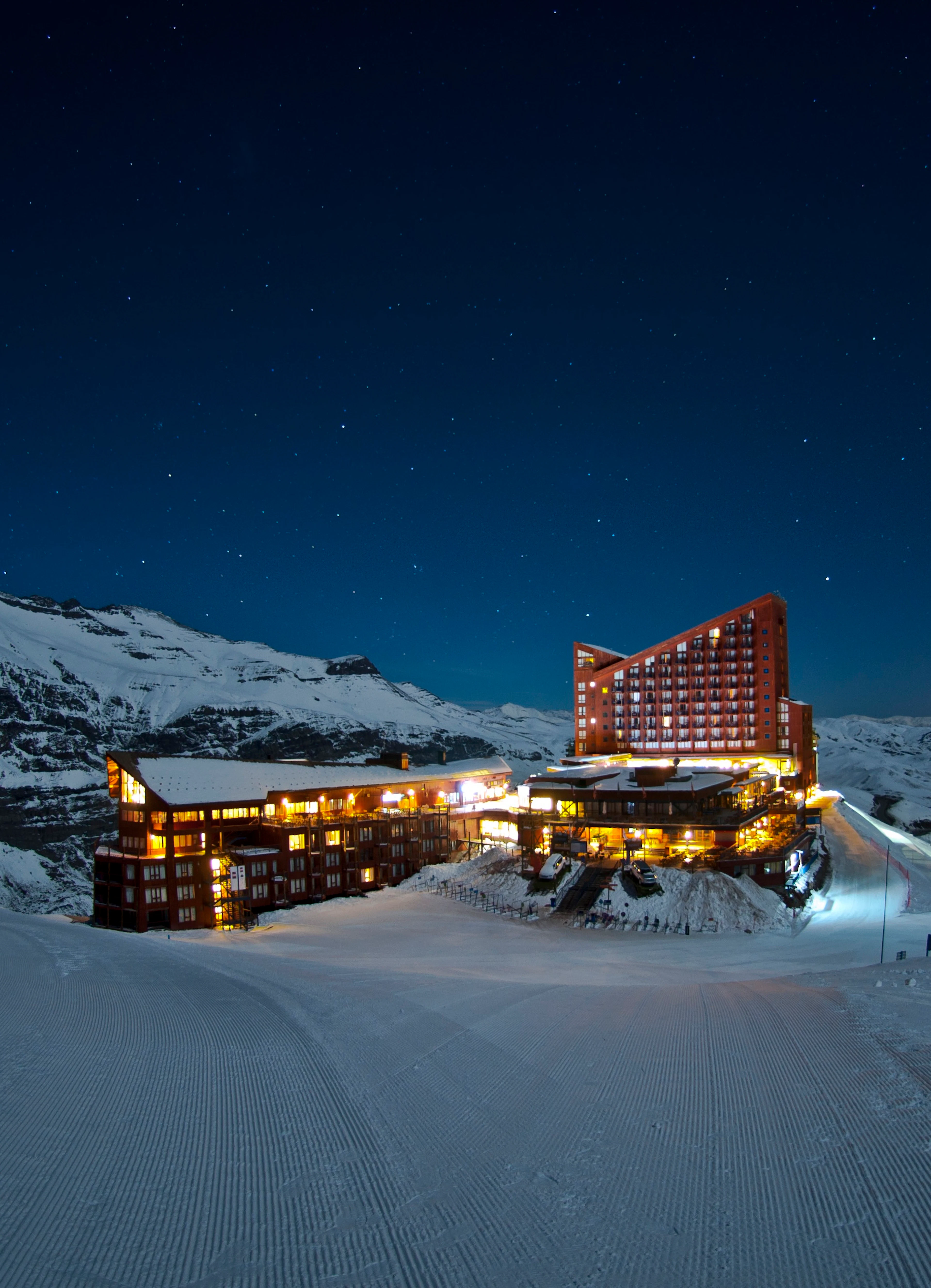 A slopeside ski hotel lit up at night