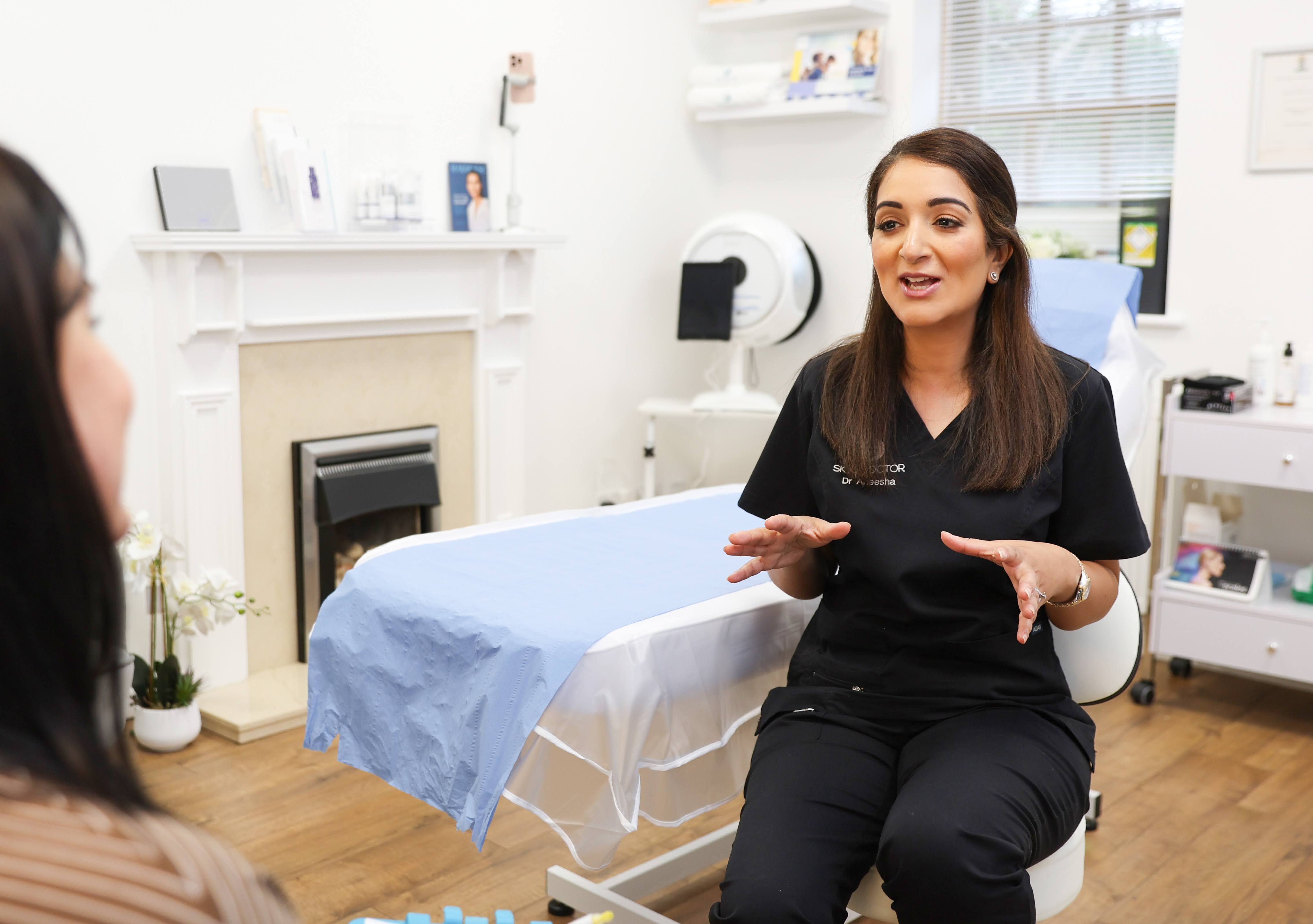 Dr Aneesha giving travel vaccination advice to a patient