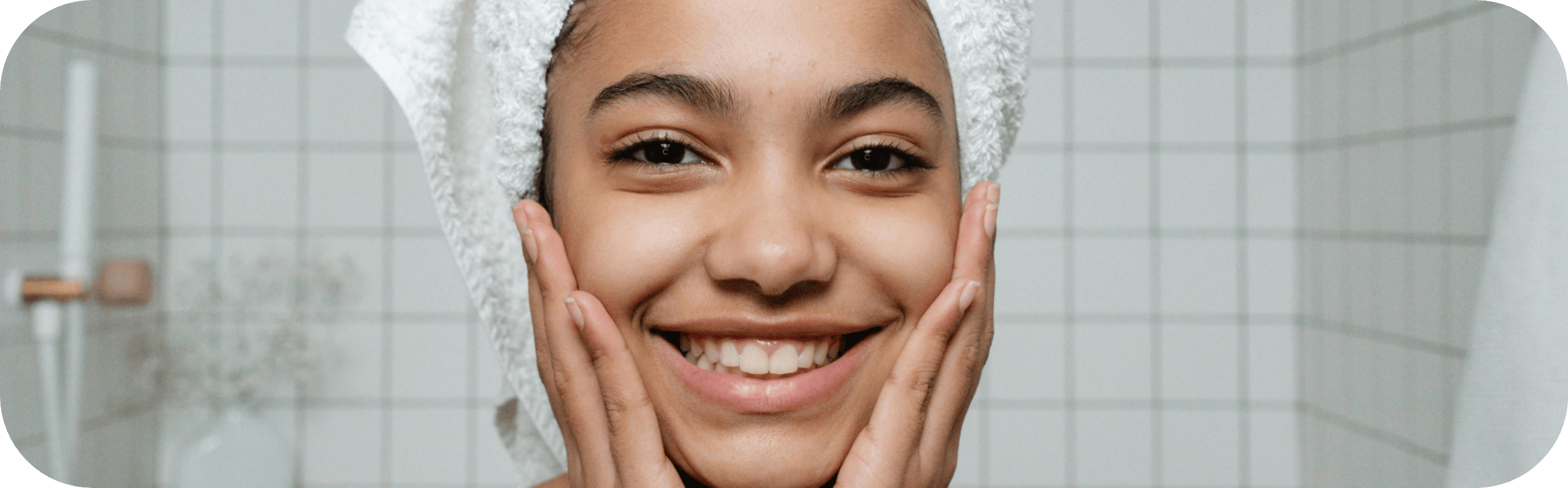 A teenager girl holding her face