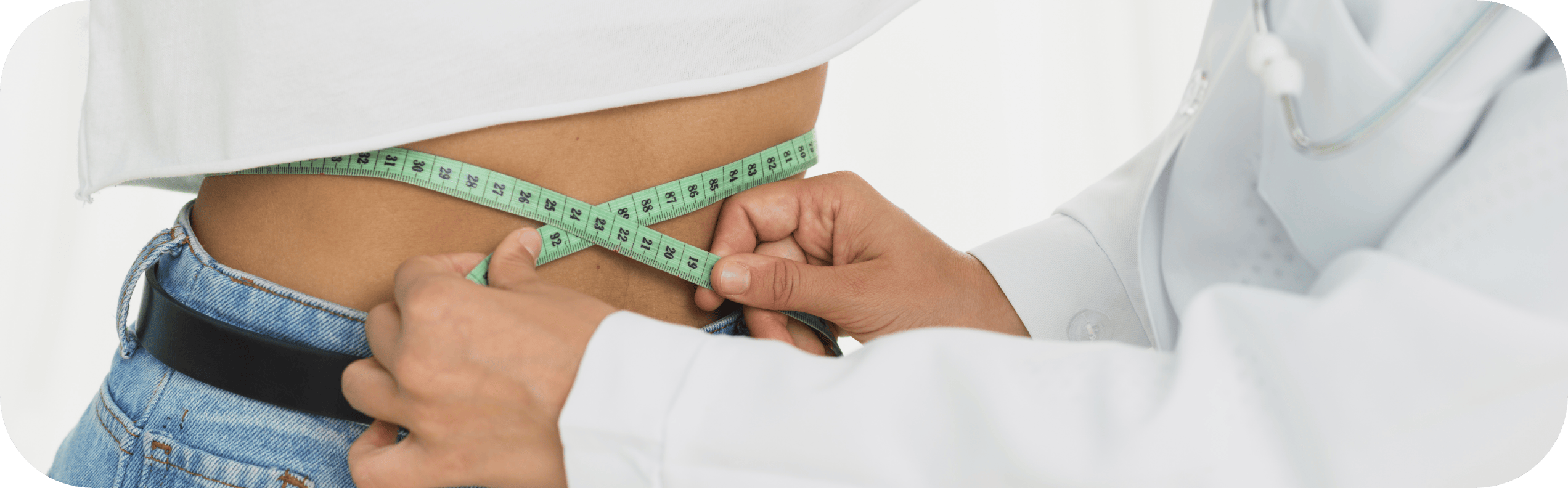 woman having her waist measured