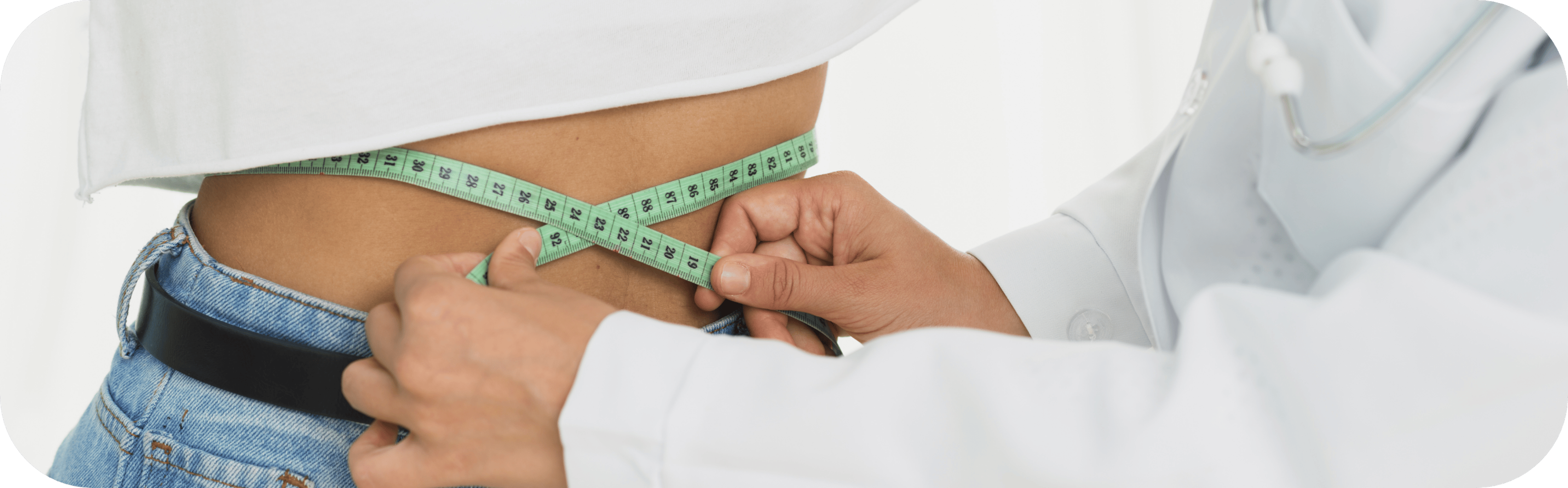 woman having her waist measured