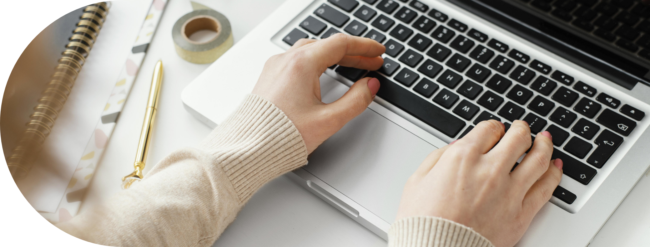 Woman typing on a laptop