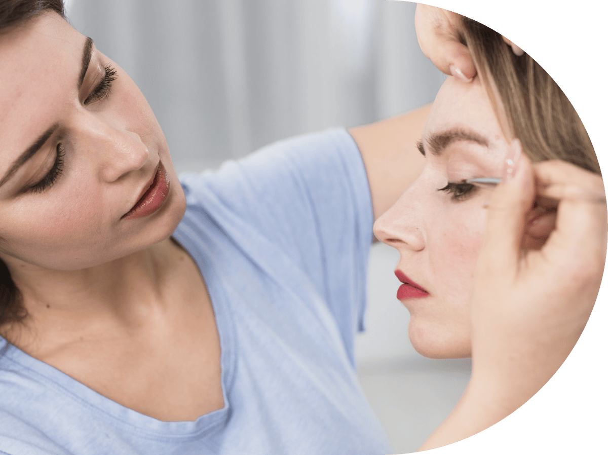 woman having eye skin tags removed