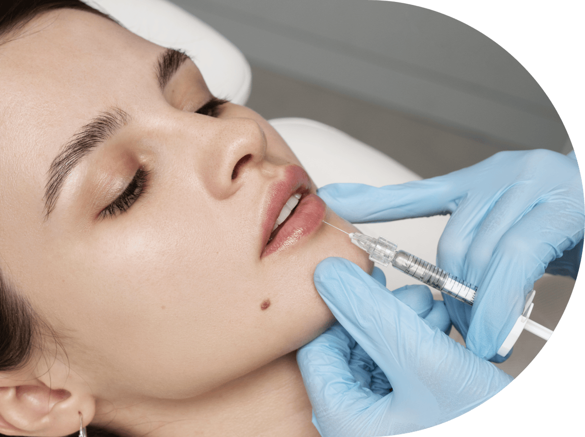 young woman having lip filler treatment