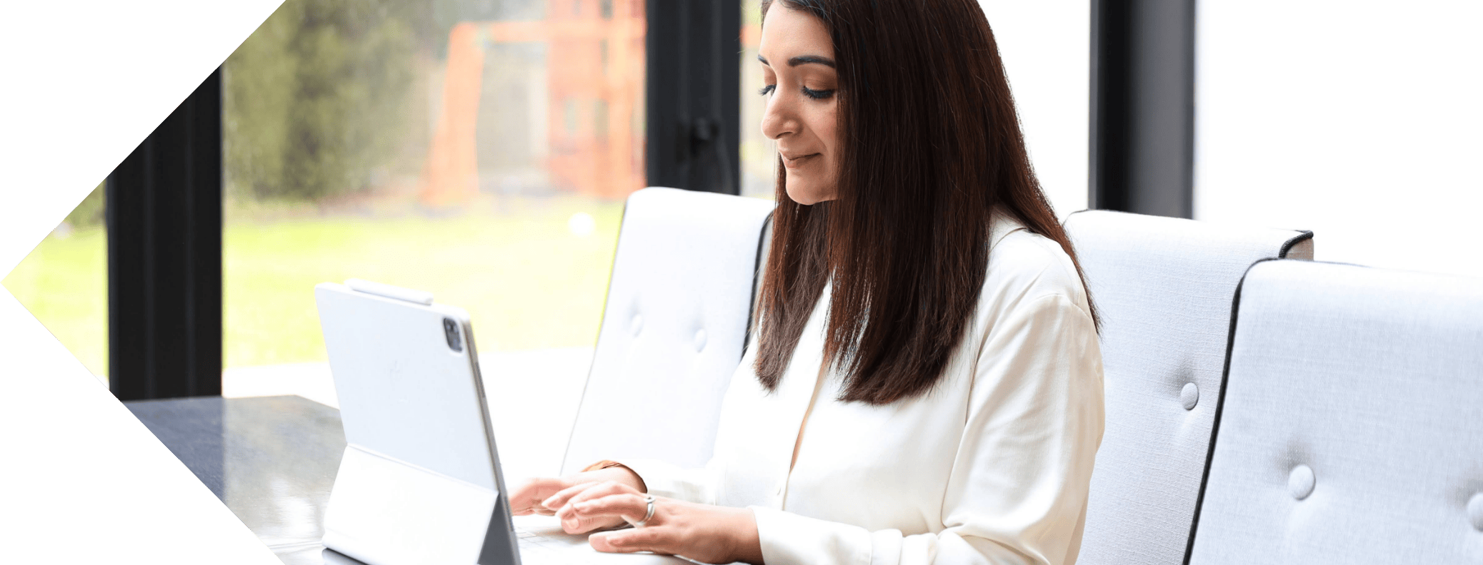 Dr Aneesha on the laptop working