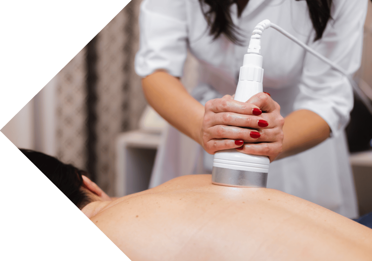 man having diathermy treatment on his back