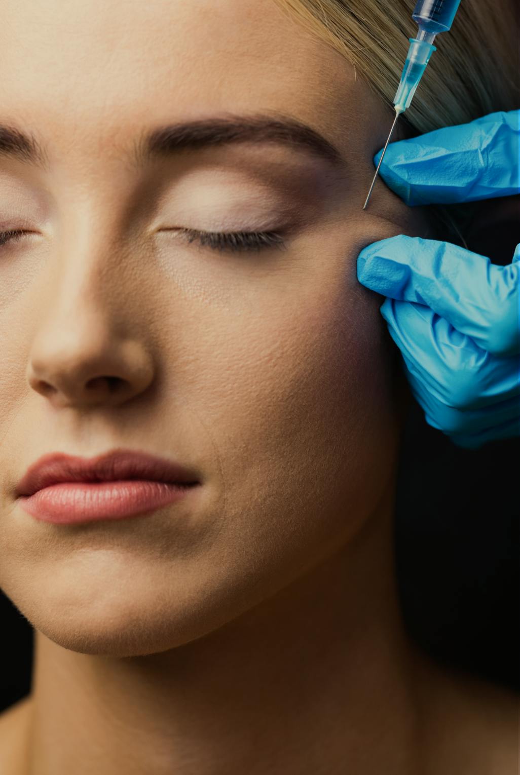 a woman having anti wrinkle injection treatment