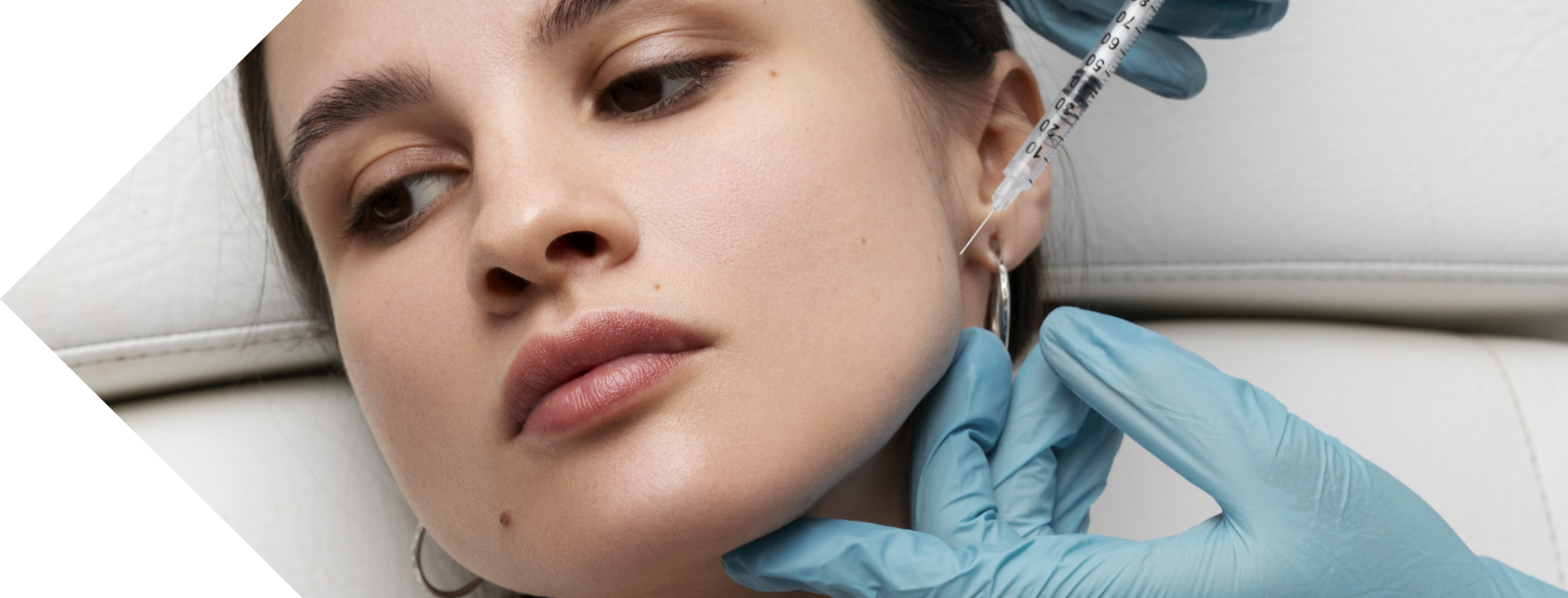 masseter injection being performed on a woman