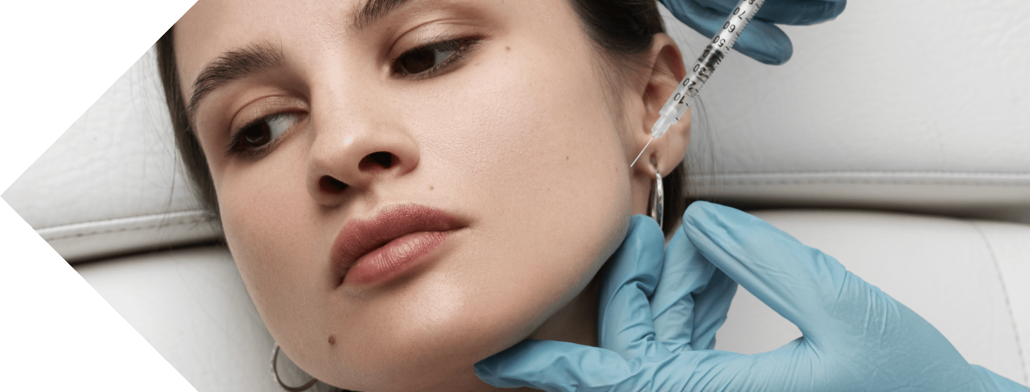 masseter injection being performed on a woman