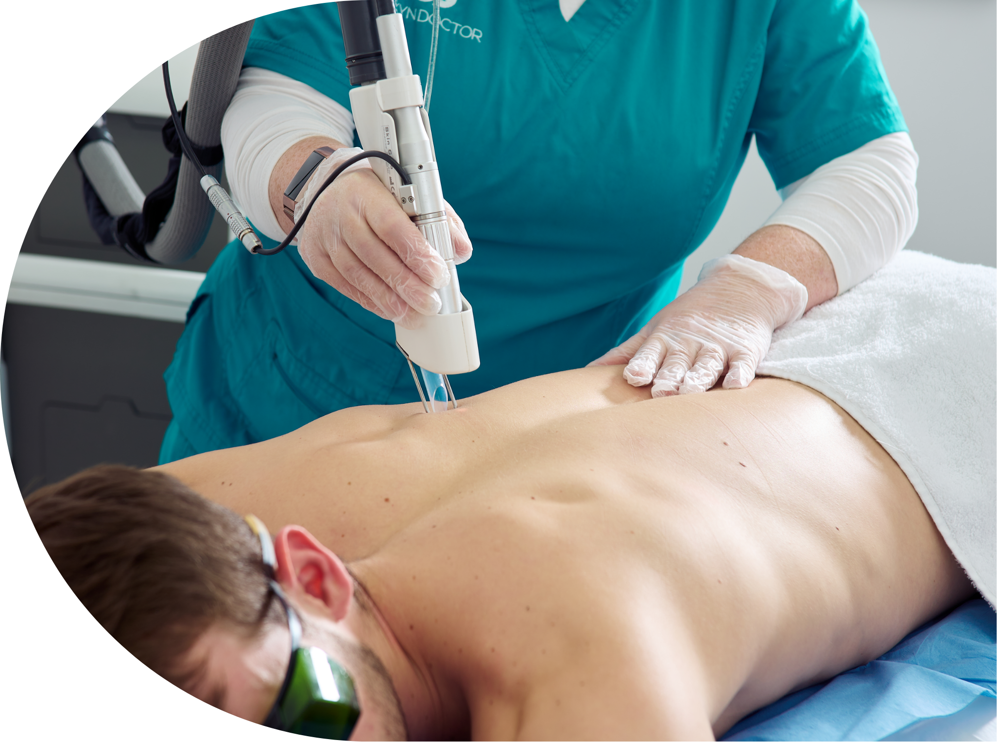 Male patient receiving laser hair removal to his back
