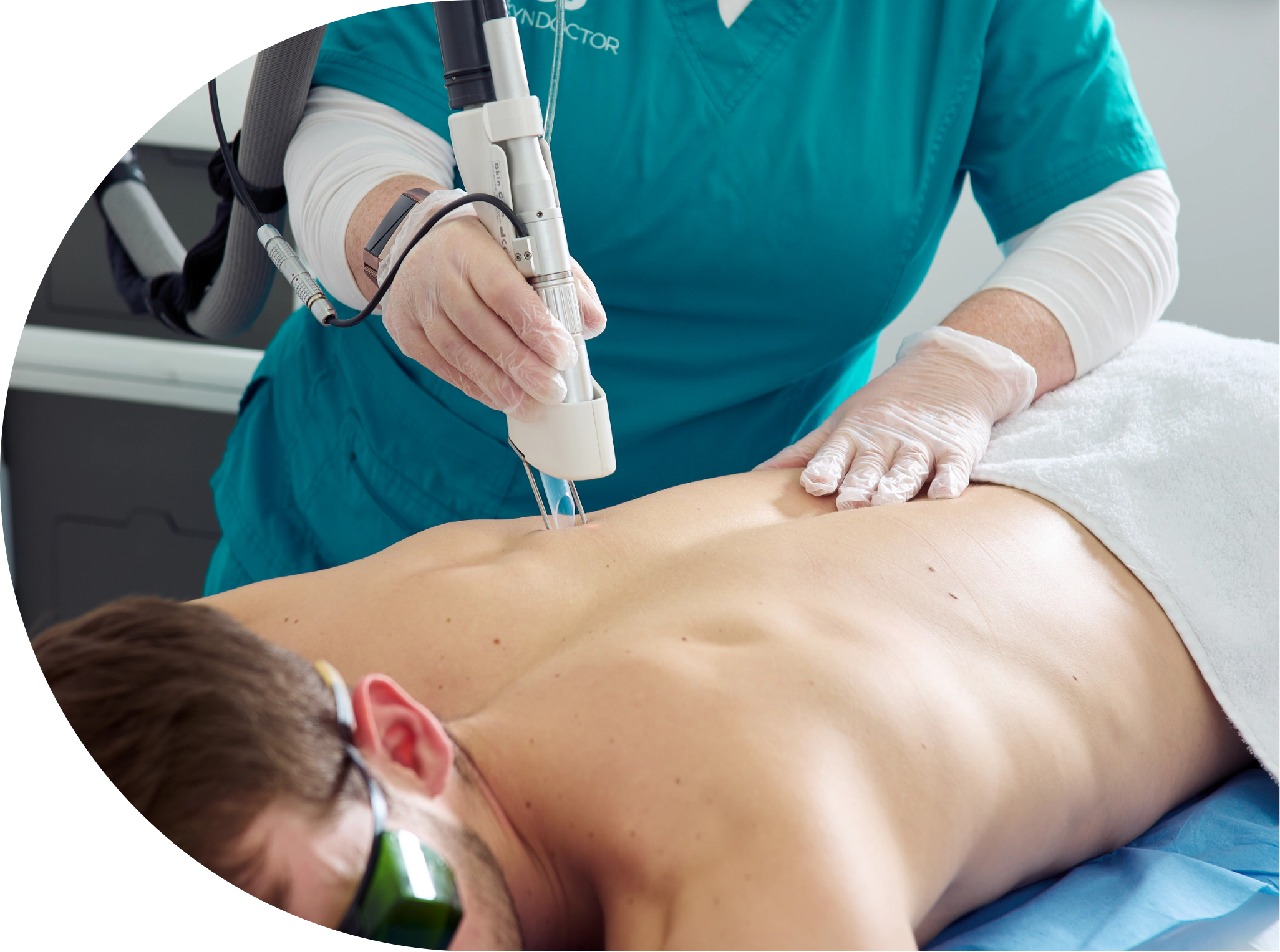 Male patient receiving laser hair removal to his back