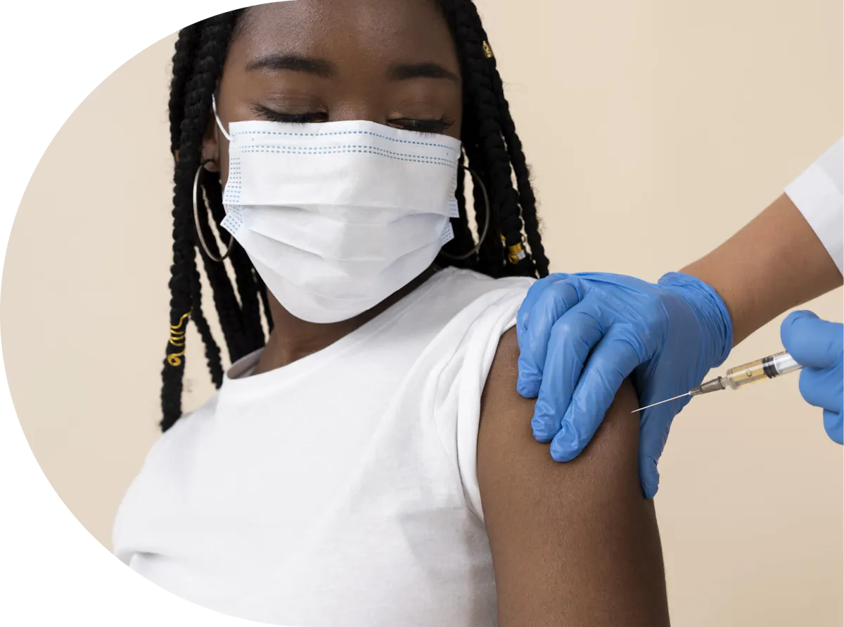 A black lady receiving her travel vaccination
