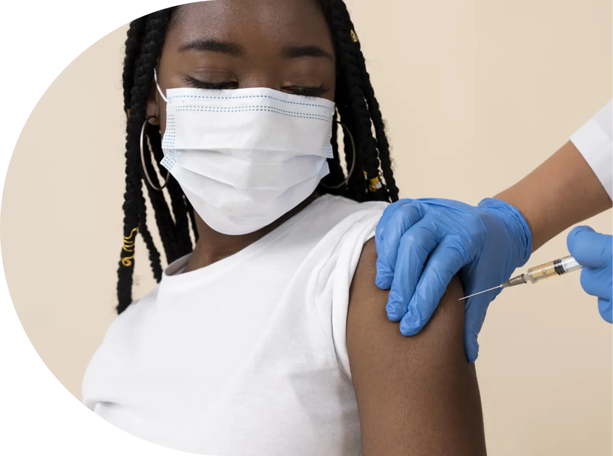 A black lady receiving her travel vaccination