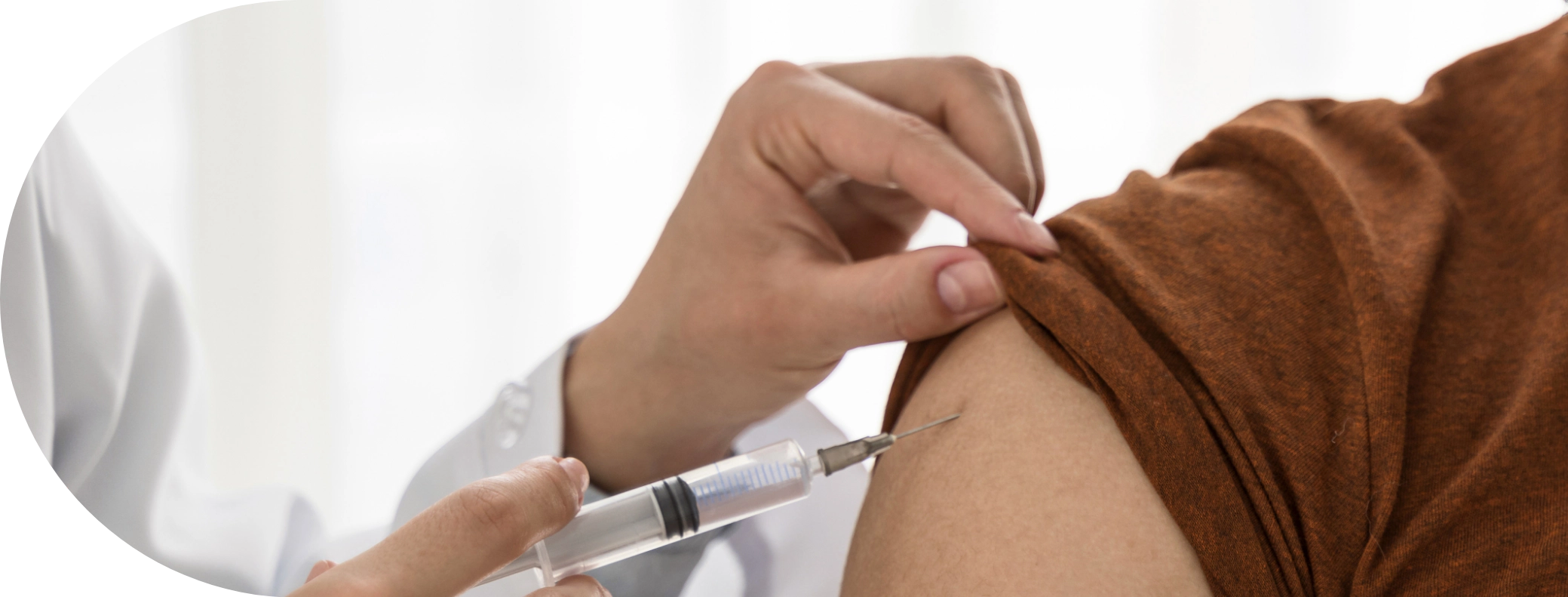 Someone receiving a Rabies Vaccine in the arm