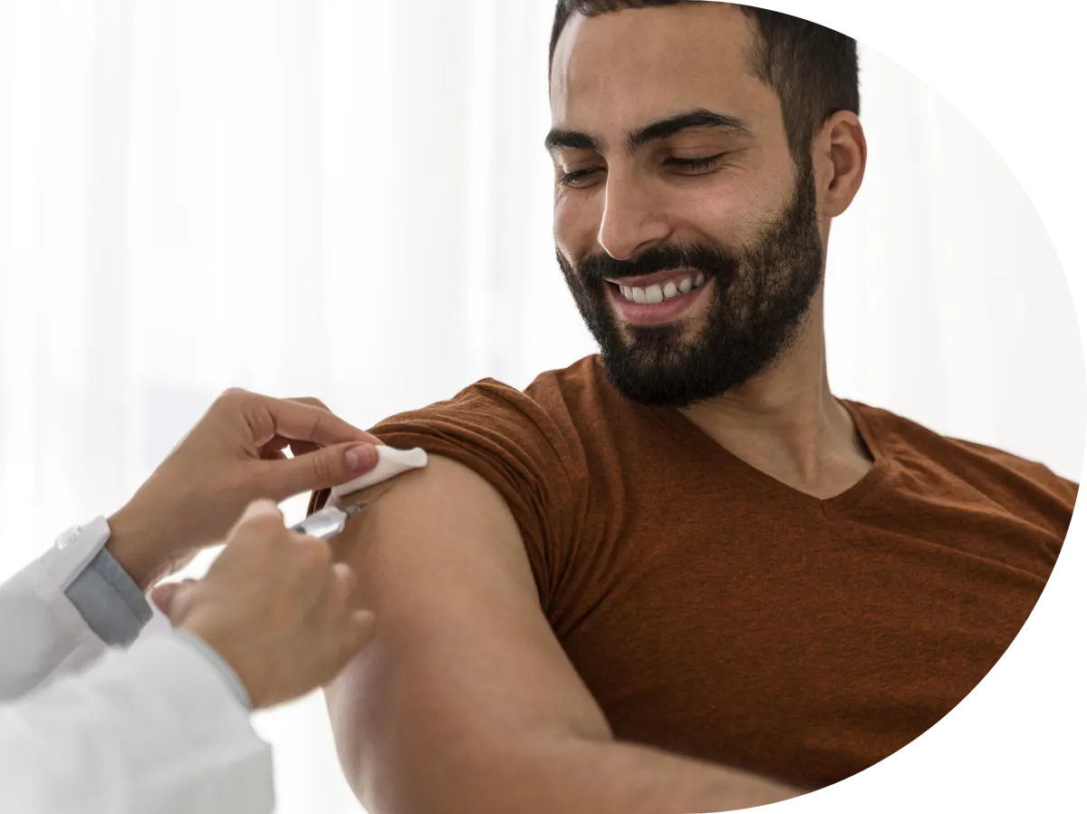 A man receiving a Rabies Vaccine in the arm