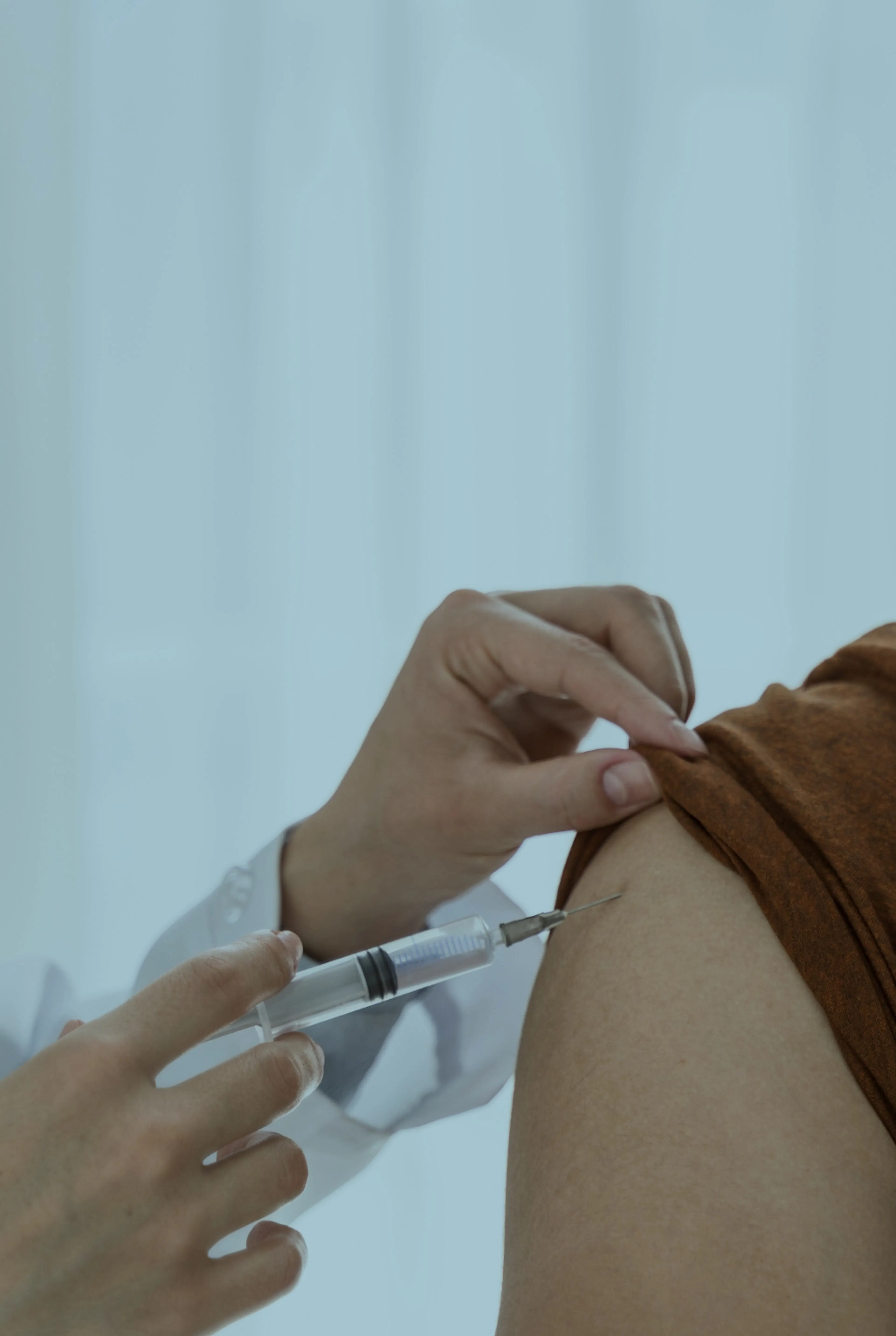 Someone receiving a Rabies Vaccine in the arm