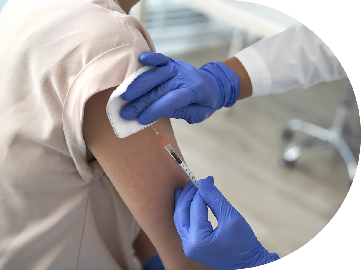 Hepatitis A vaccine being administered to a womans arm