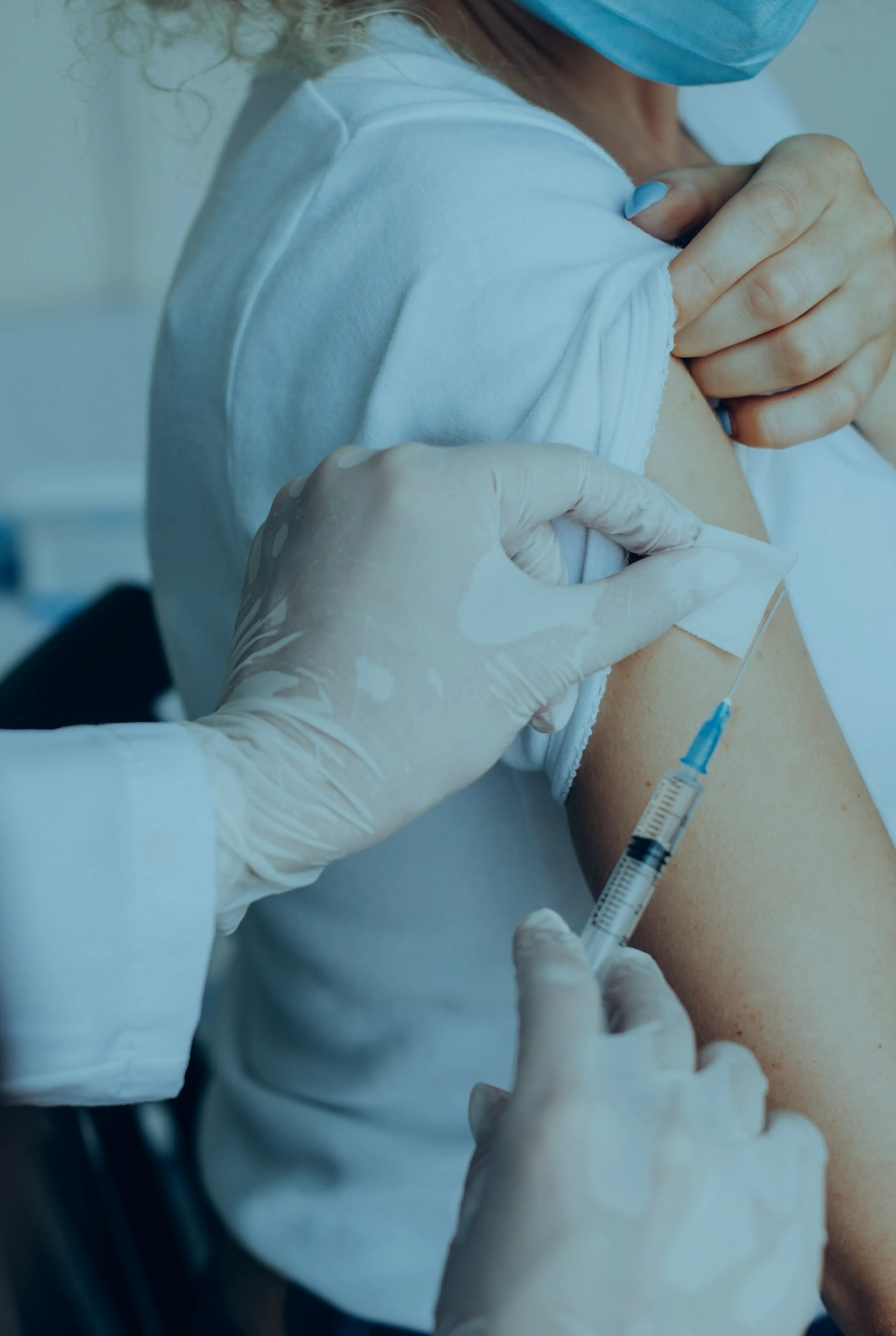 Woman having a Hepititas B vaccine