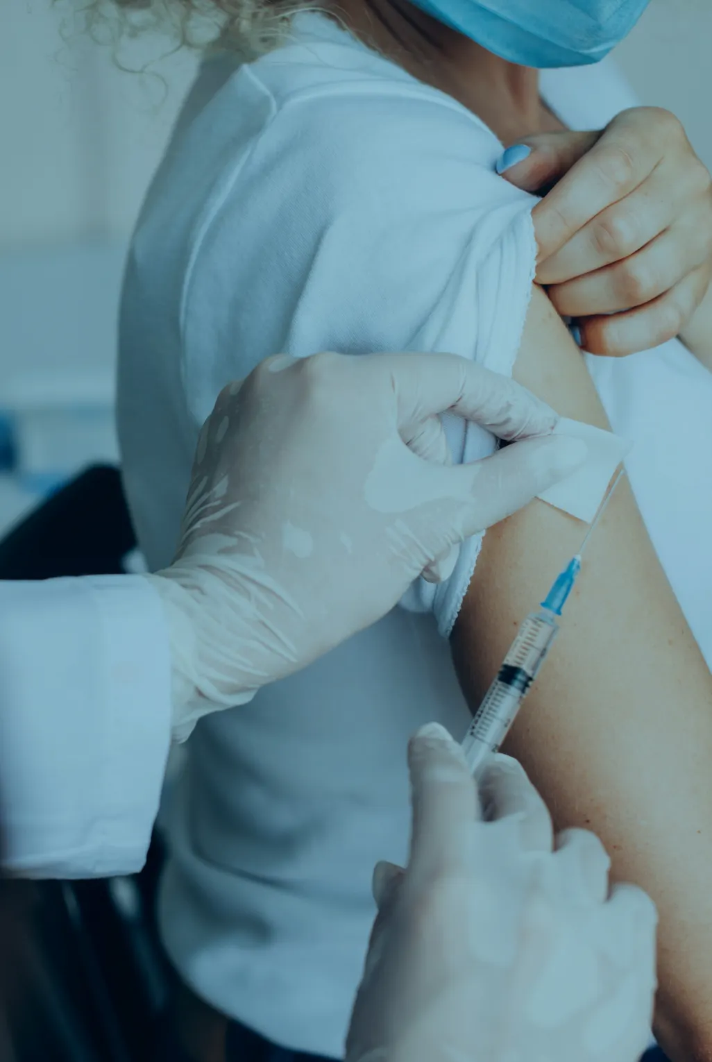 Woman having a Hepititas B vaccine