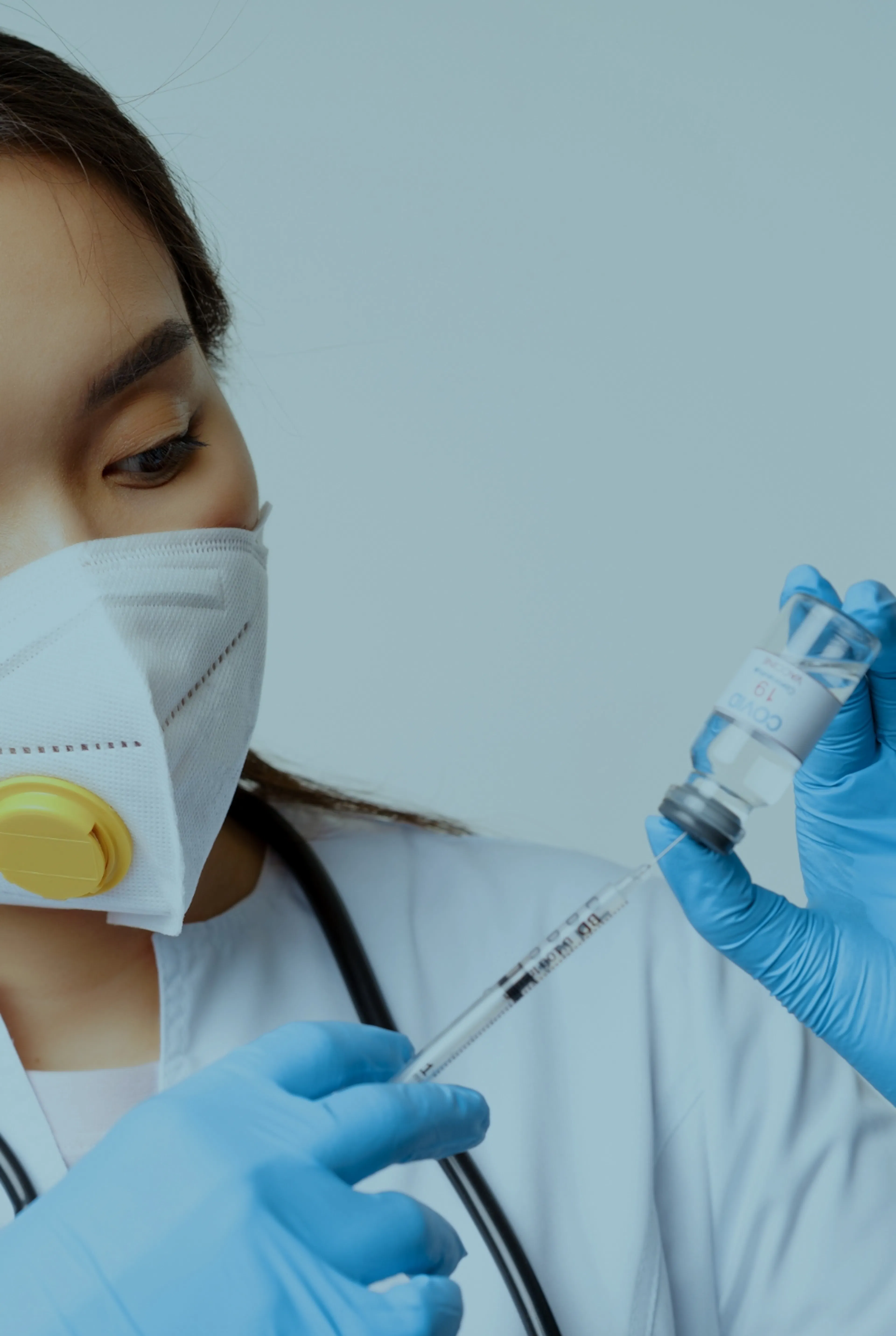 Clinician syringing yellow fever vaccine