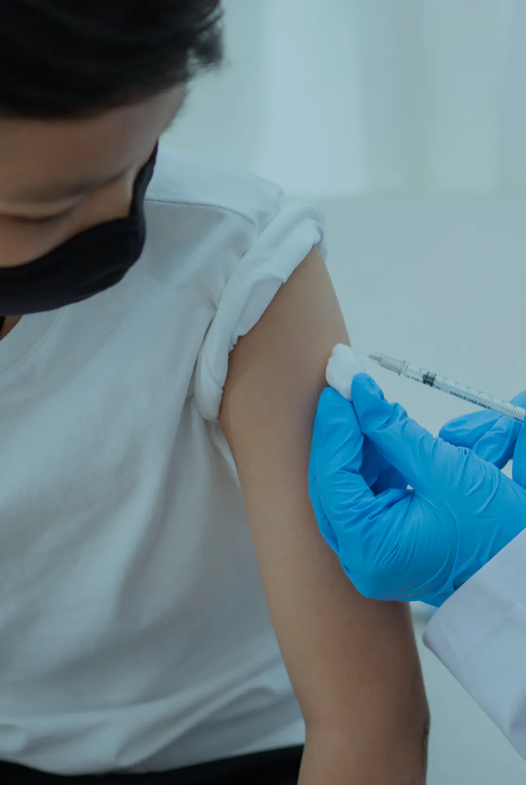 Young boy having the Meningitis vaccine