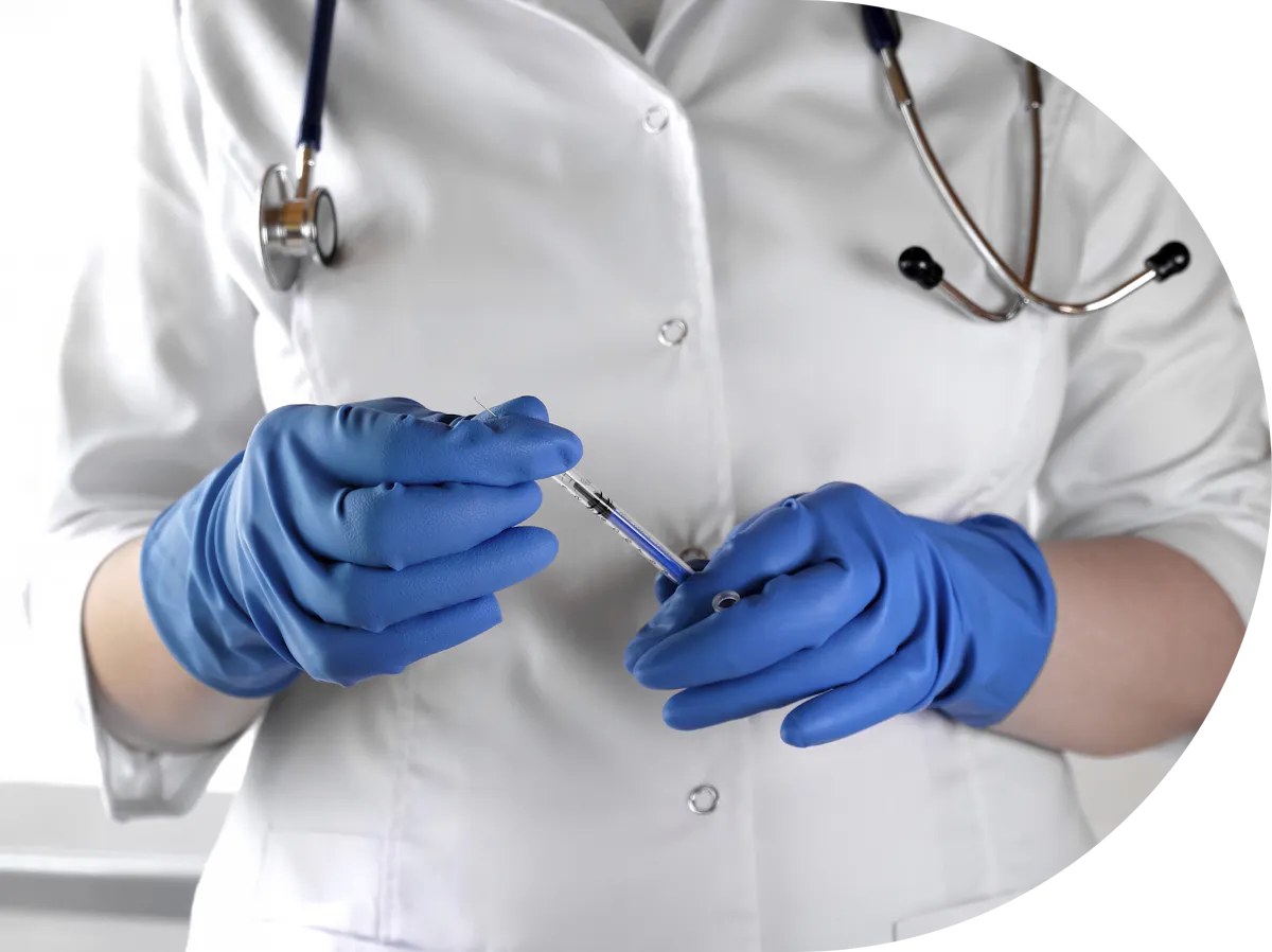 Clinician readying to administer a vaccine