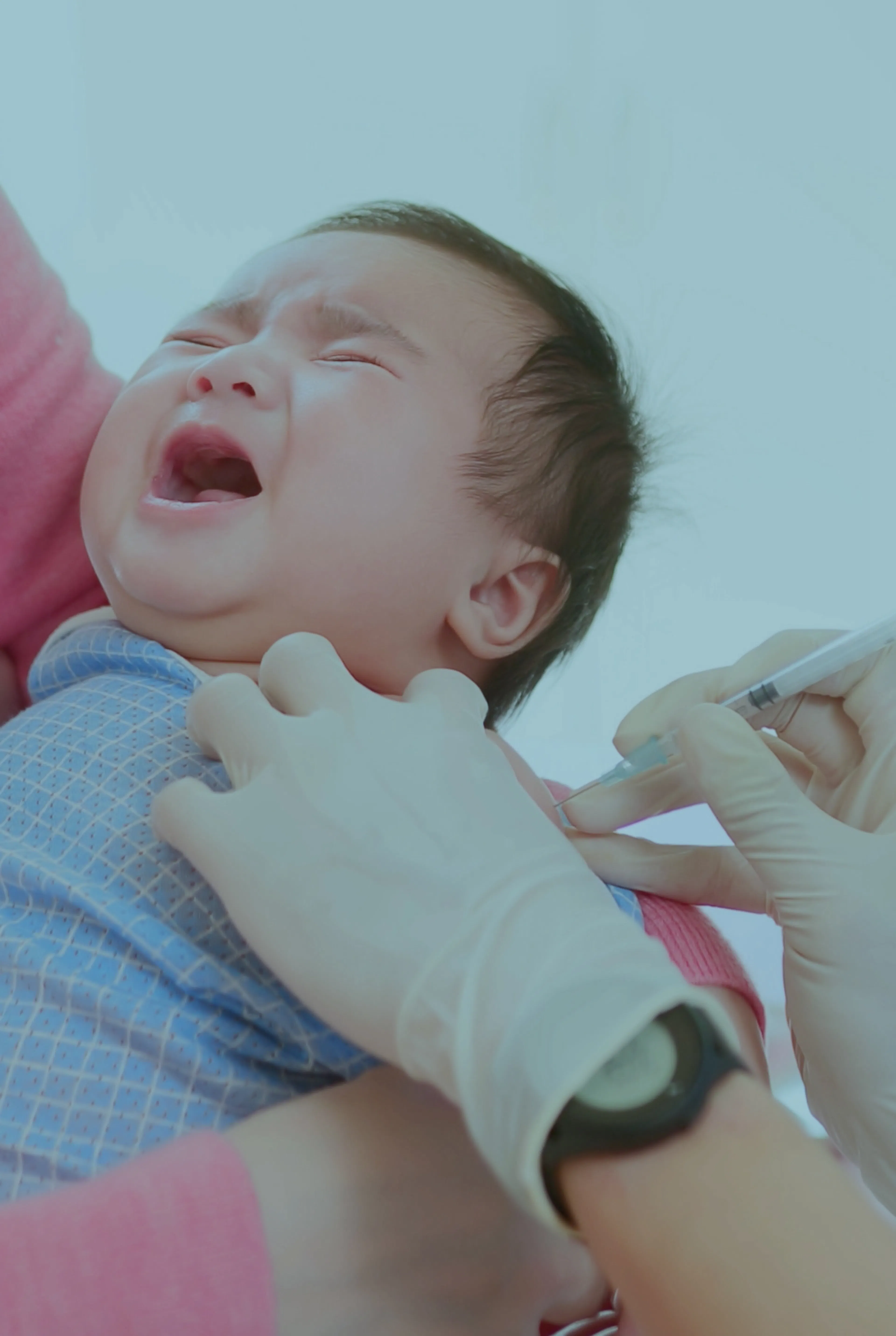 Infant having whooping cough vaccine
