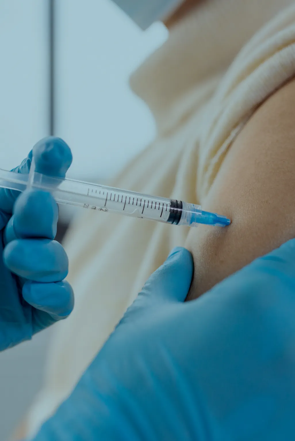 Patient having a vaccination in the arm