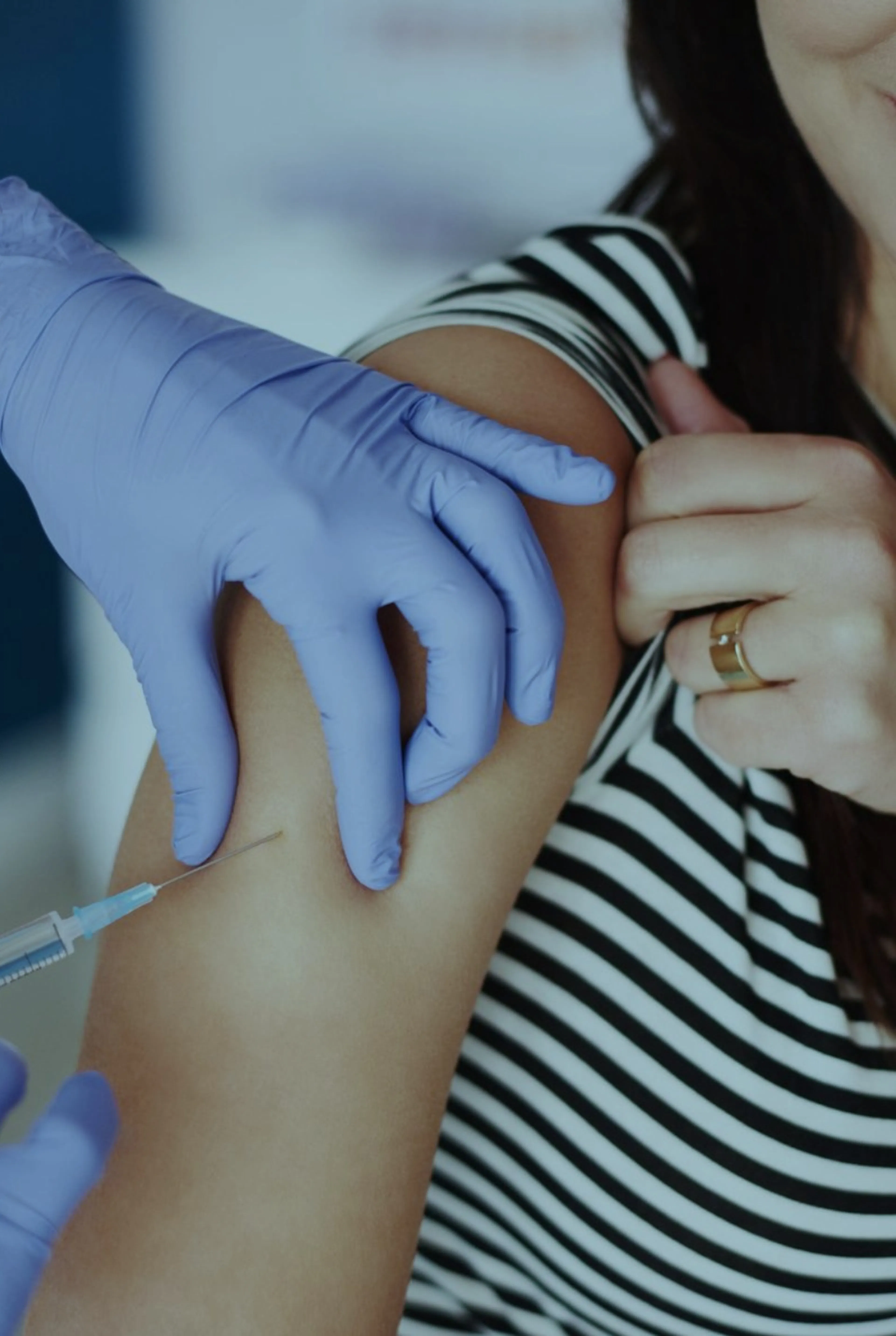 woman having a Hayfever injection into her arm