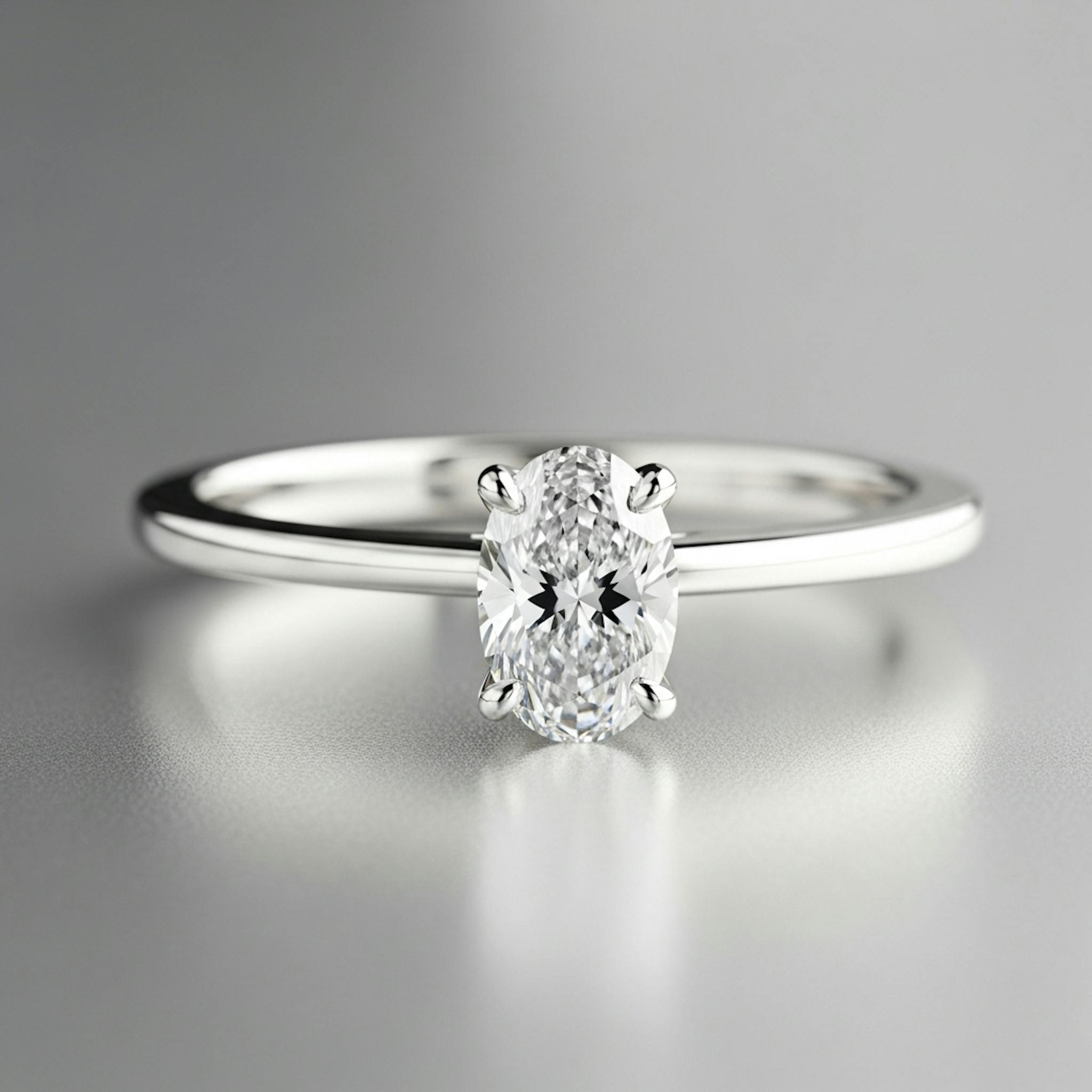 A diamond ring minimalist style with a thin band and oval center