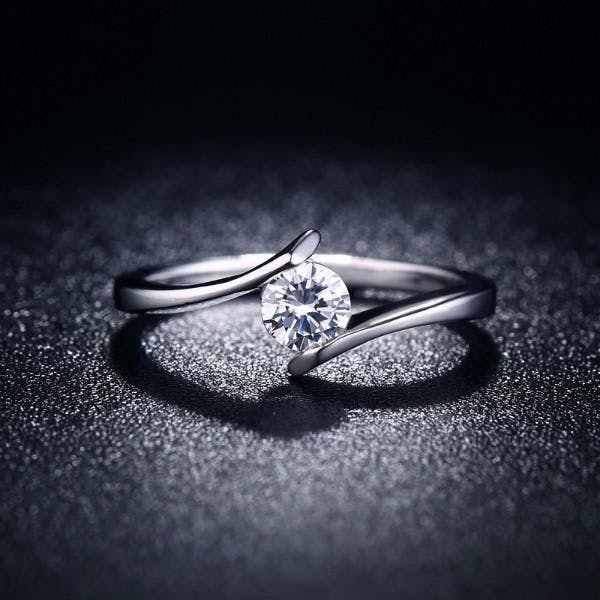 A minimal diamond ring with a tension setting.