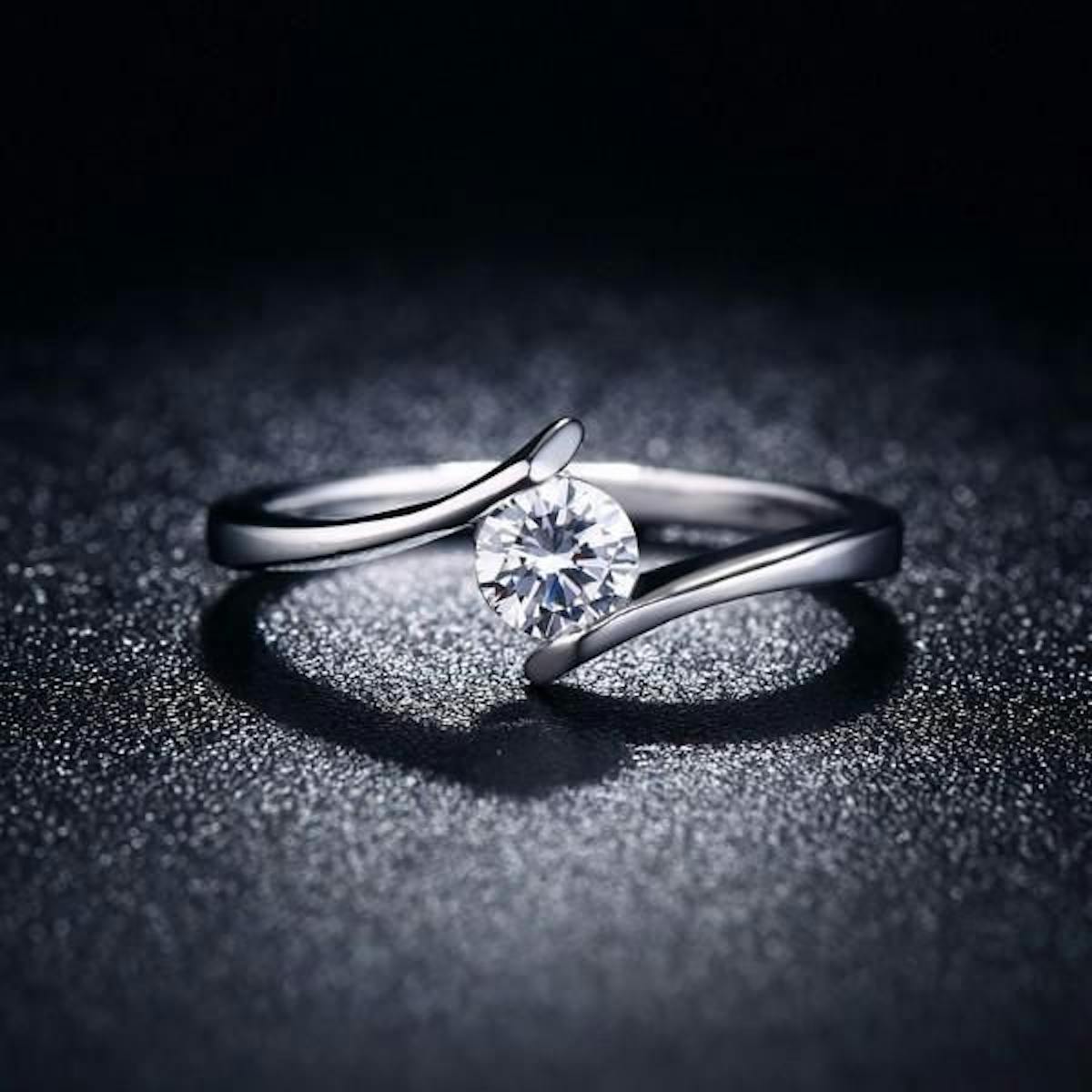  A minimal diamond ring with a tension setting.