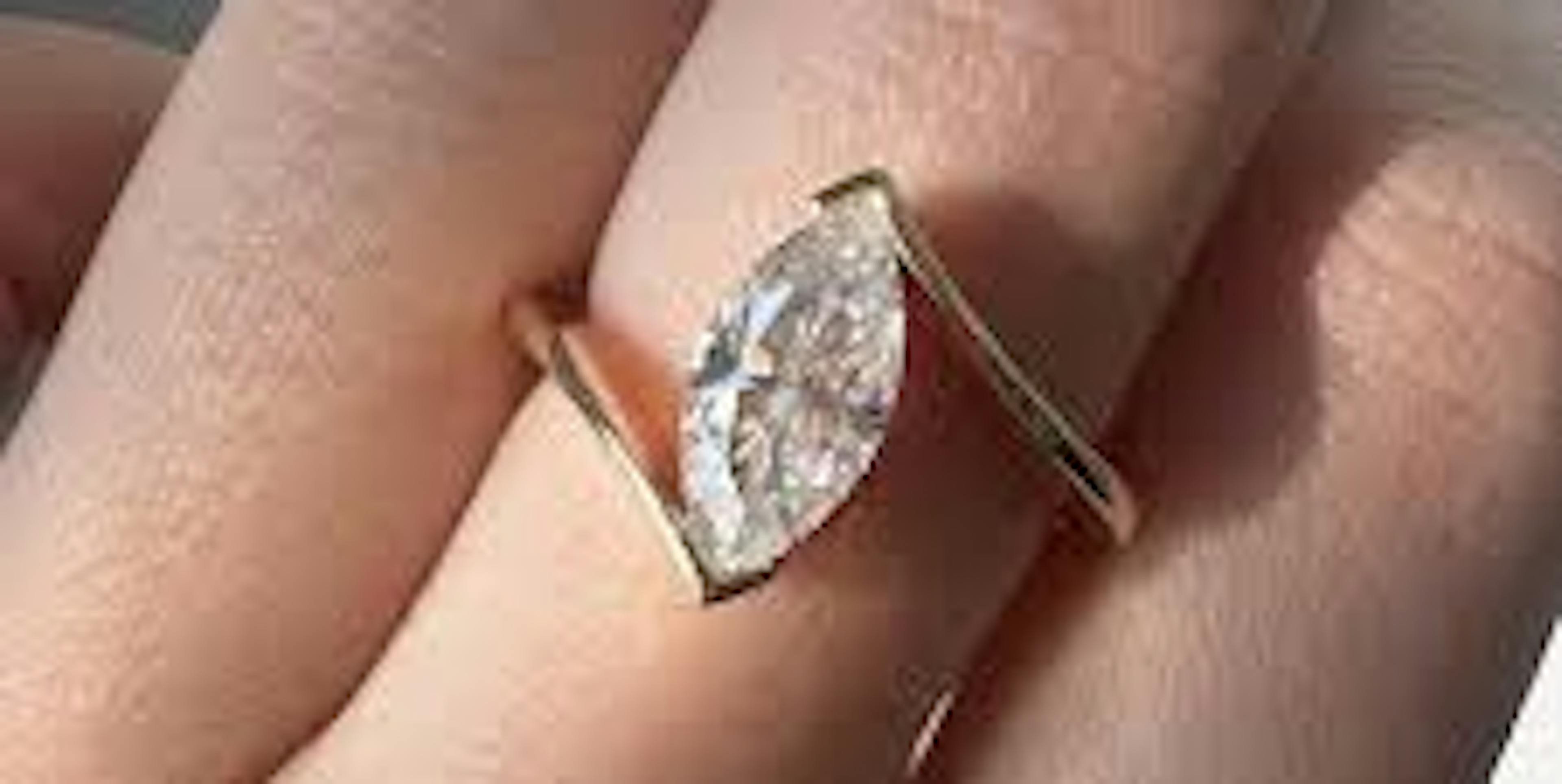  A minimal diamond ring with a tension setting.