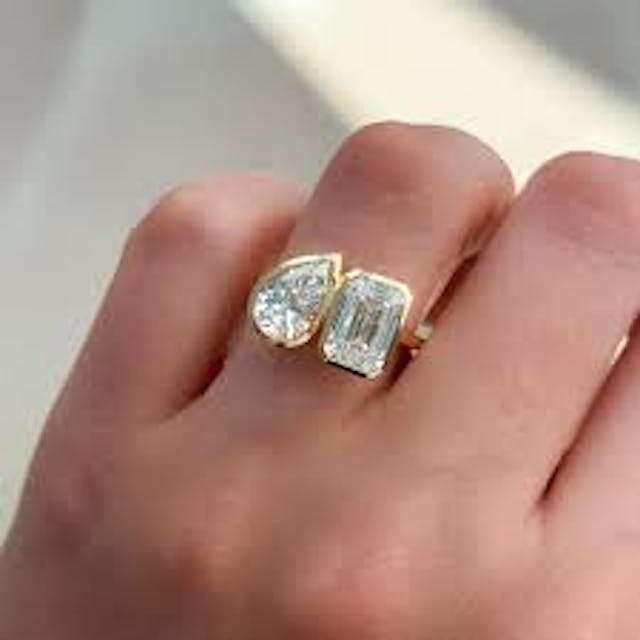 Emerald Cut + Pear Diamond in a Bezel Setting