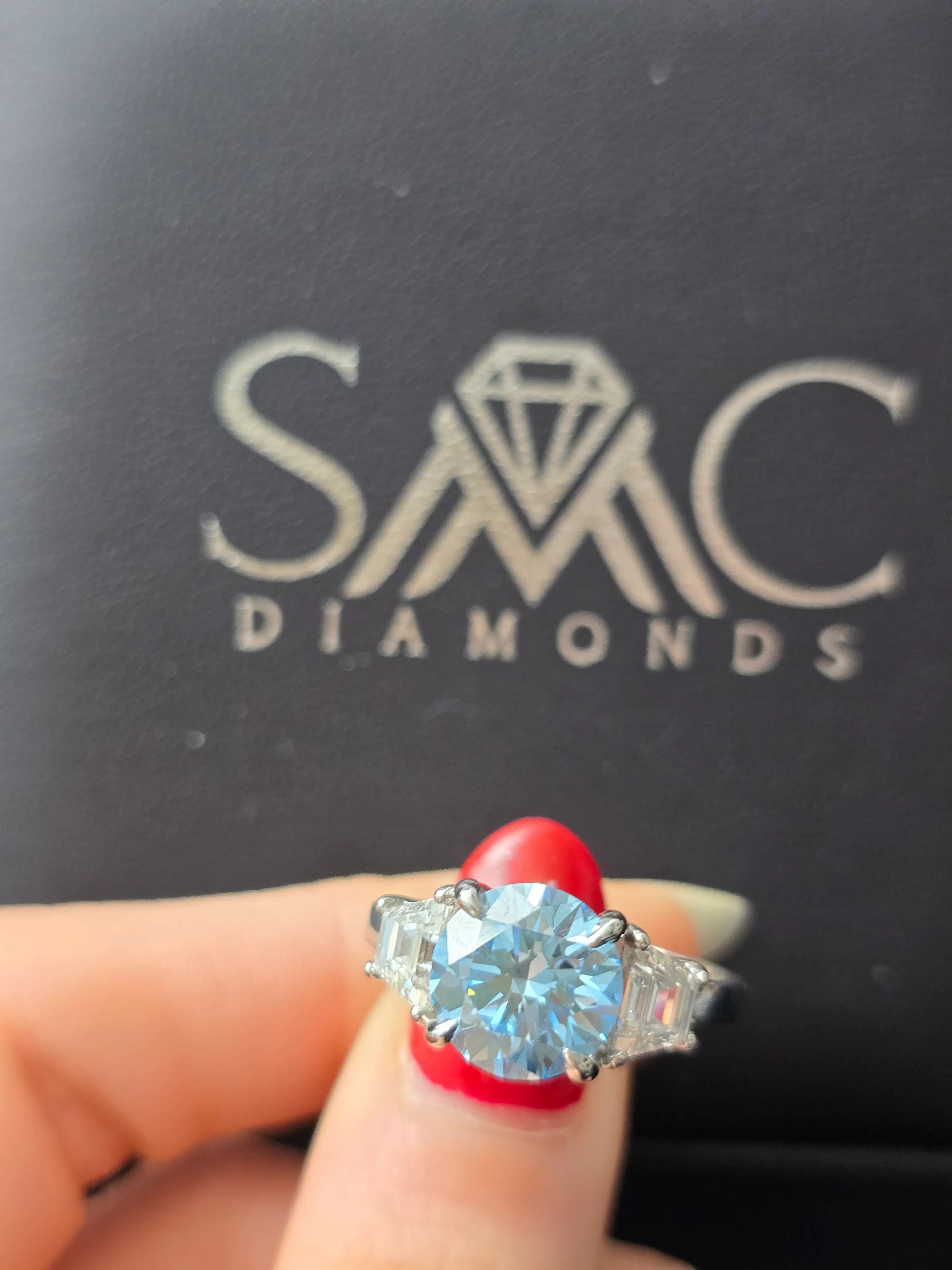 Three-stone round diamond engagement ring in 14K white gold at SMC Diamonds