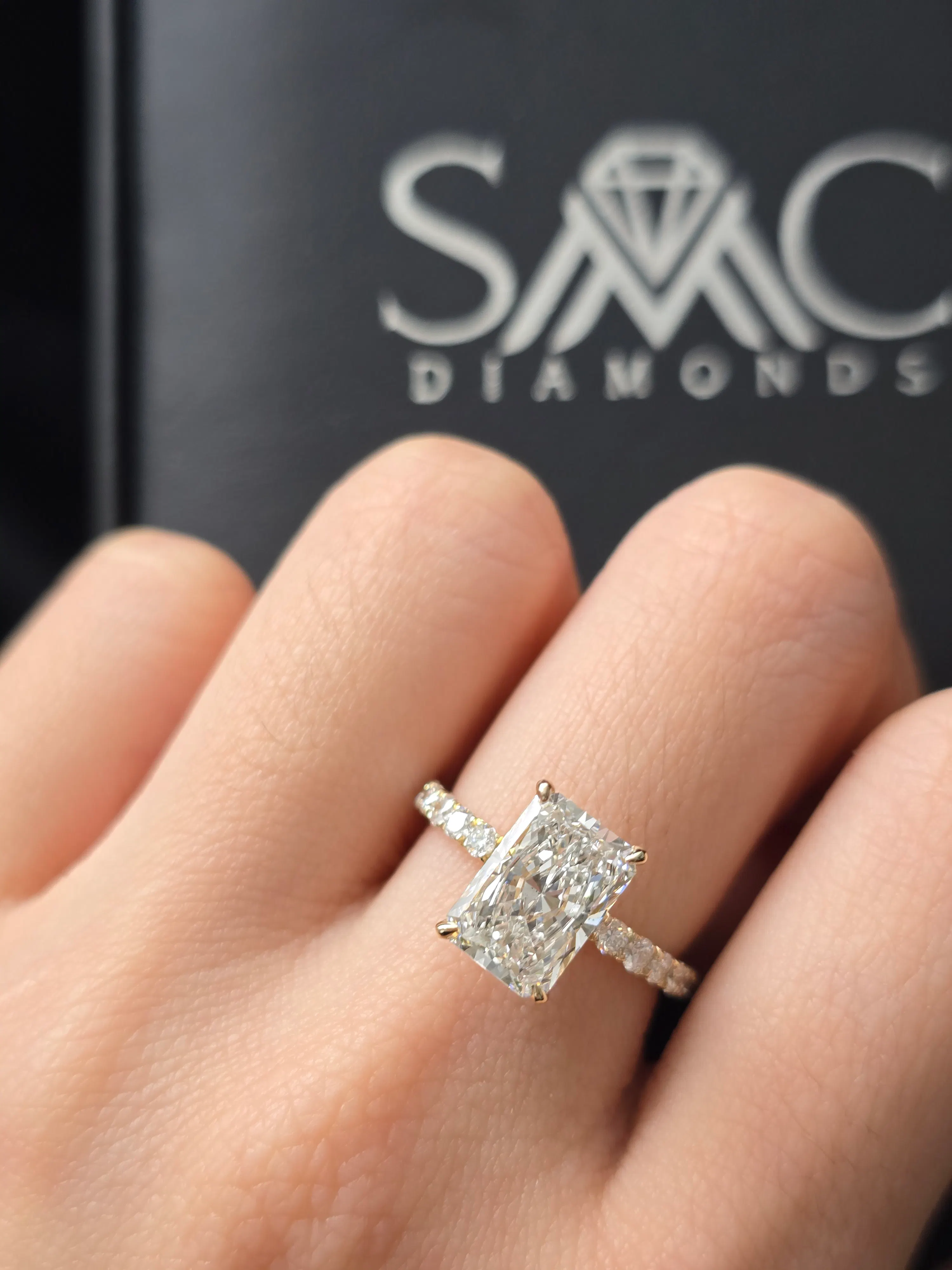 Radiant cut diamond engagement ring with pavé band in 14K yellow gold at SMC Diamonds
