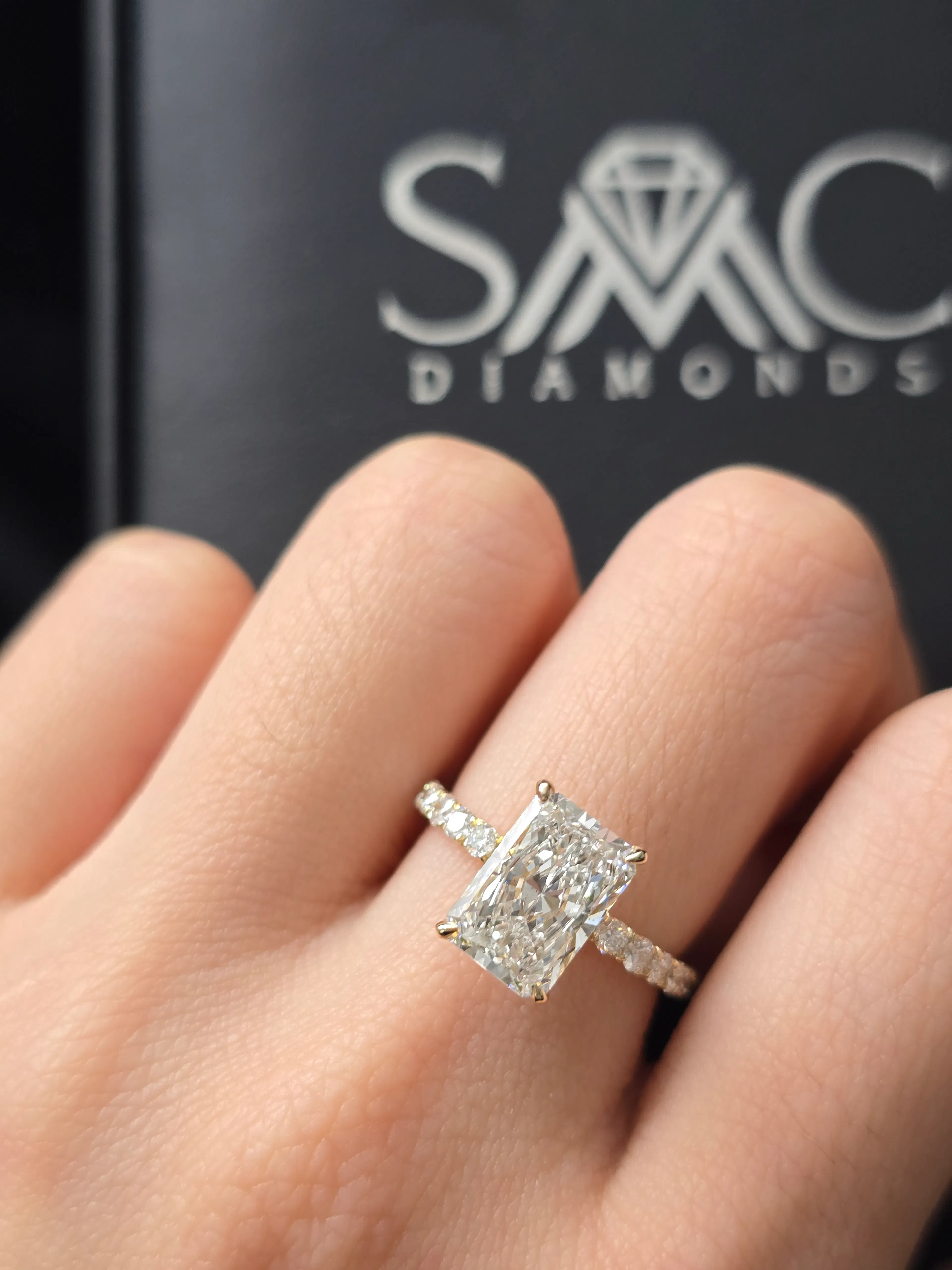 Radiant cut diamond engagement ring with pavé band in 14K yellow gold at SMC Diamonds
