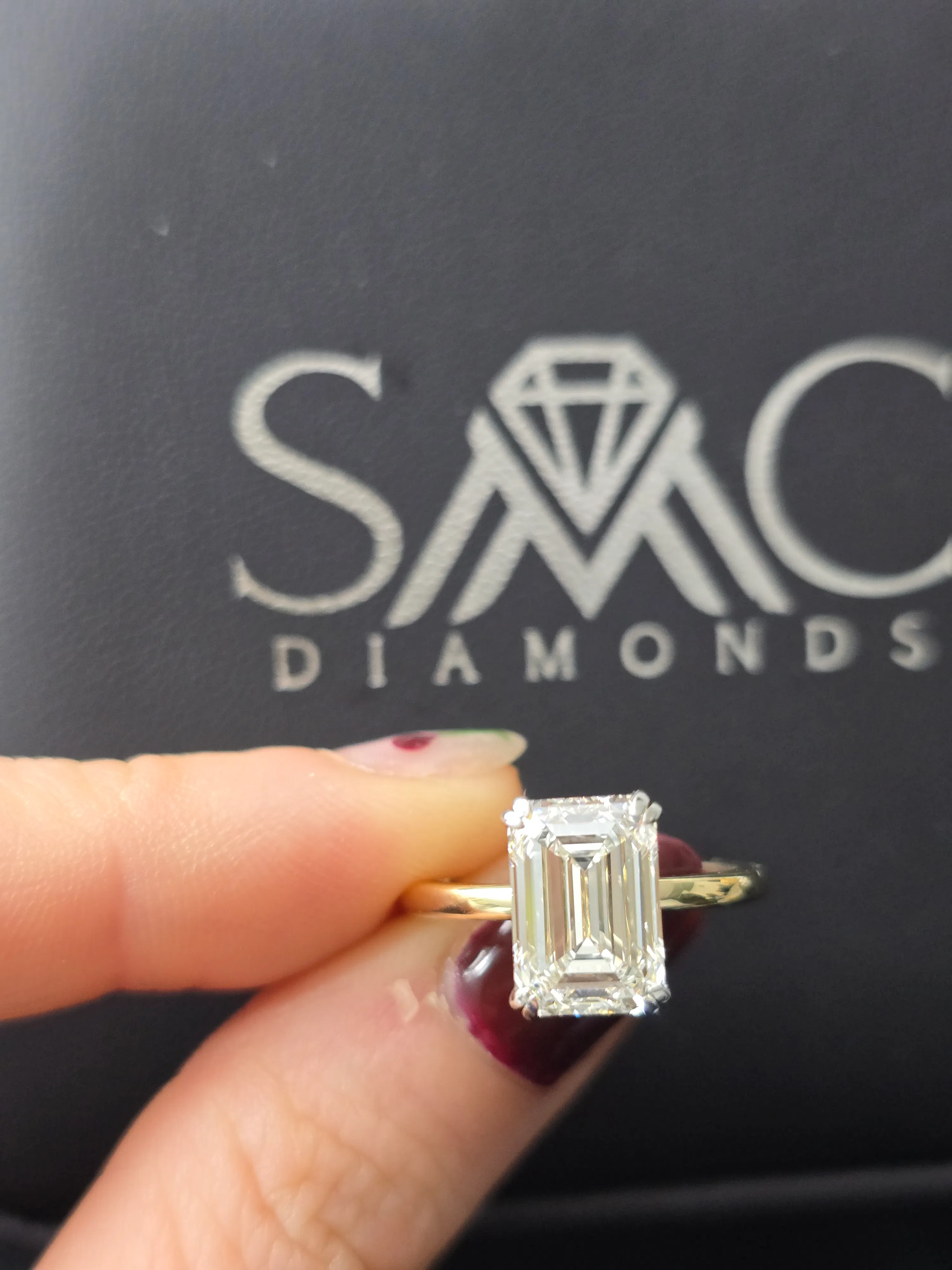 Emerald cut diamond engagement ring in 14K yellow gold at SMC Diamonds