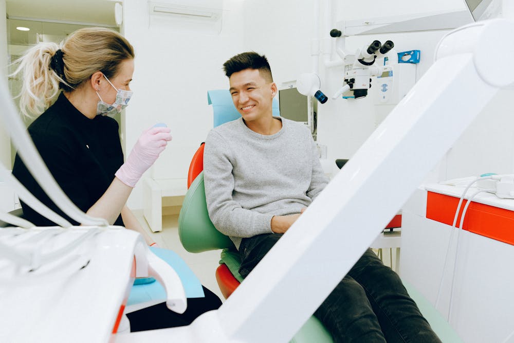 Dentist explaining dental care importance to patient pic