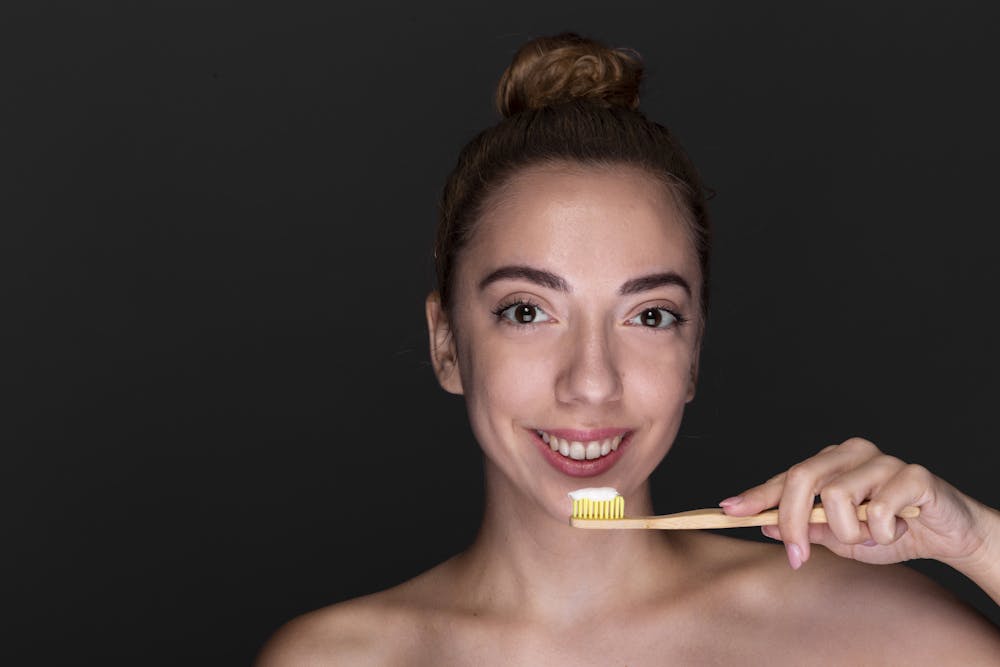 A girl brushing teeth image