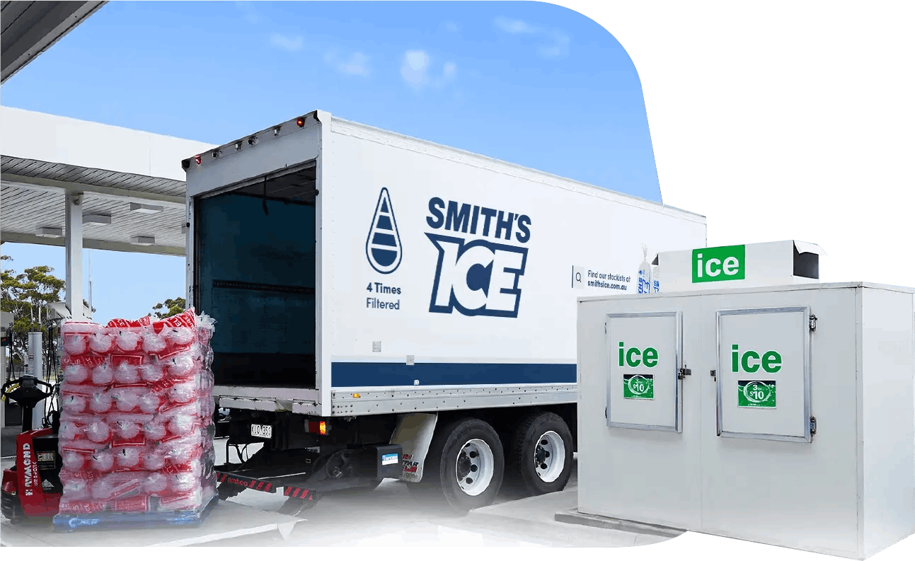 Smith's ice truck delivering a pallet of ice at a service station.