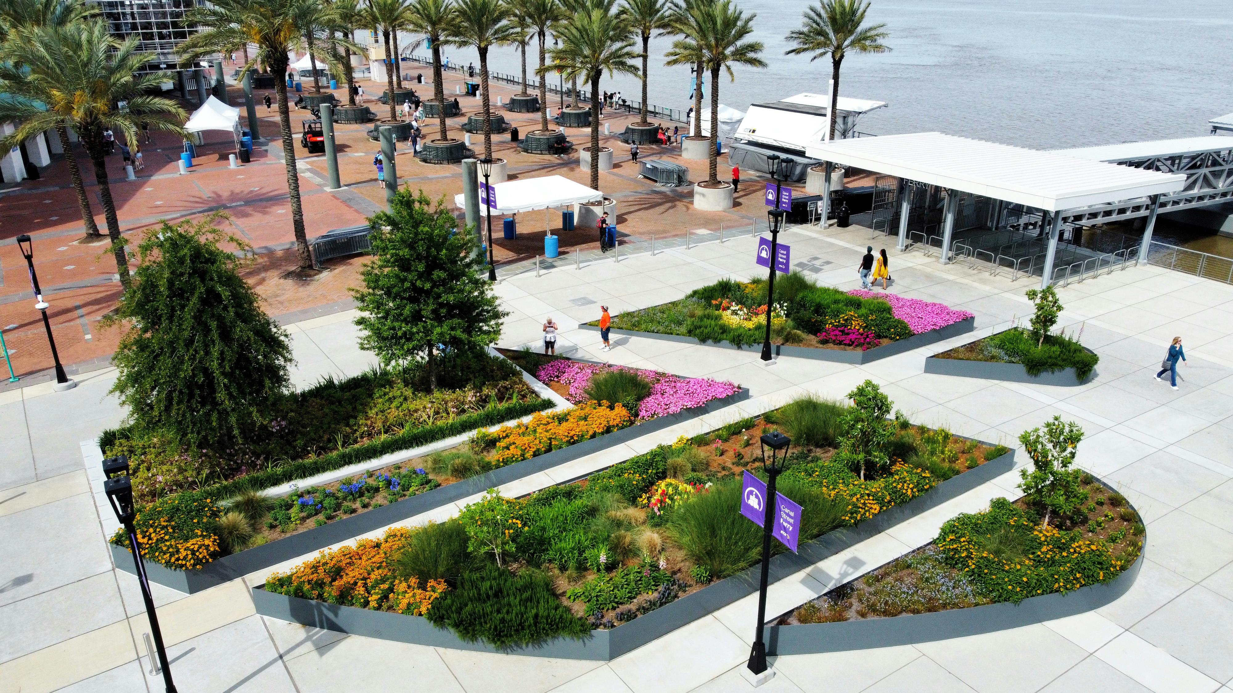 aerial view of new orleans riverfront park with plants in planters