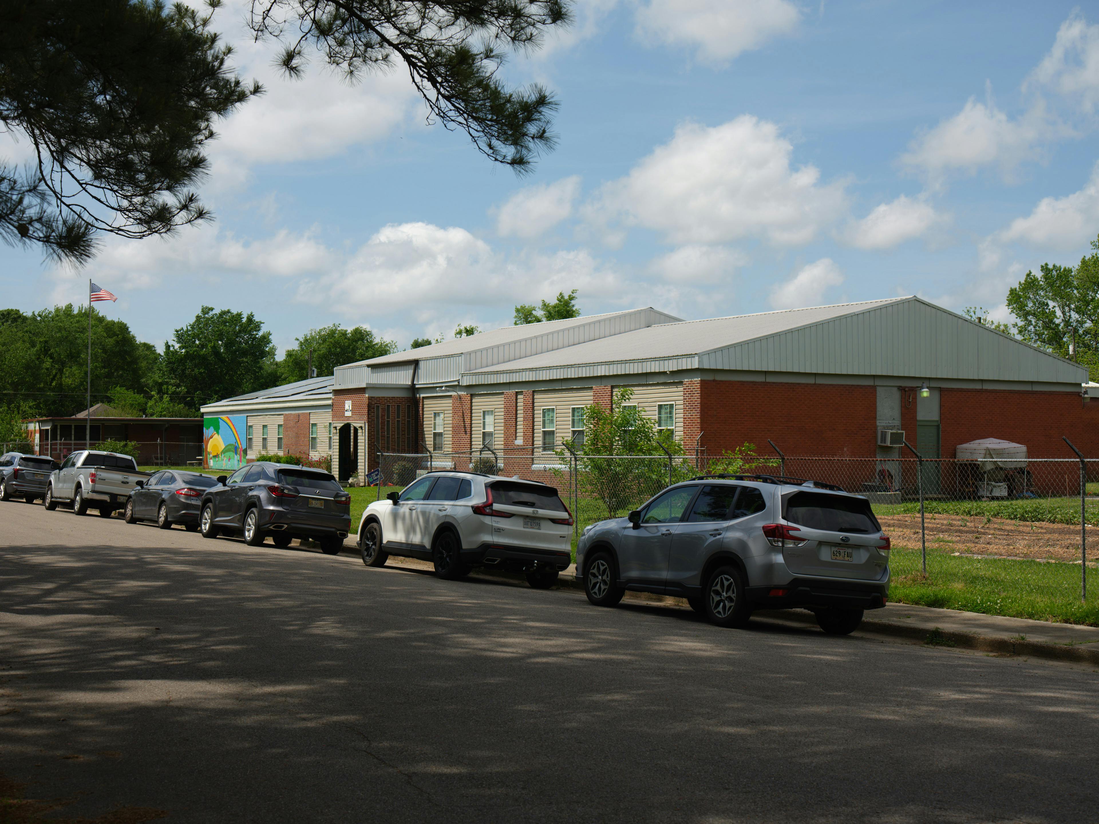 community center building with cars parked out front