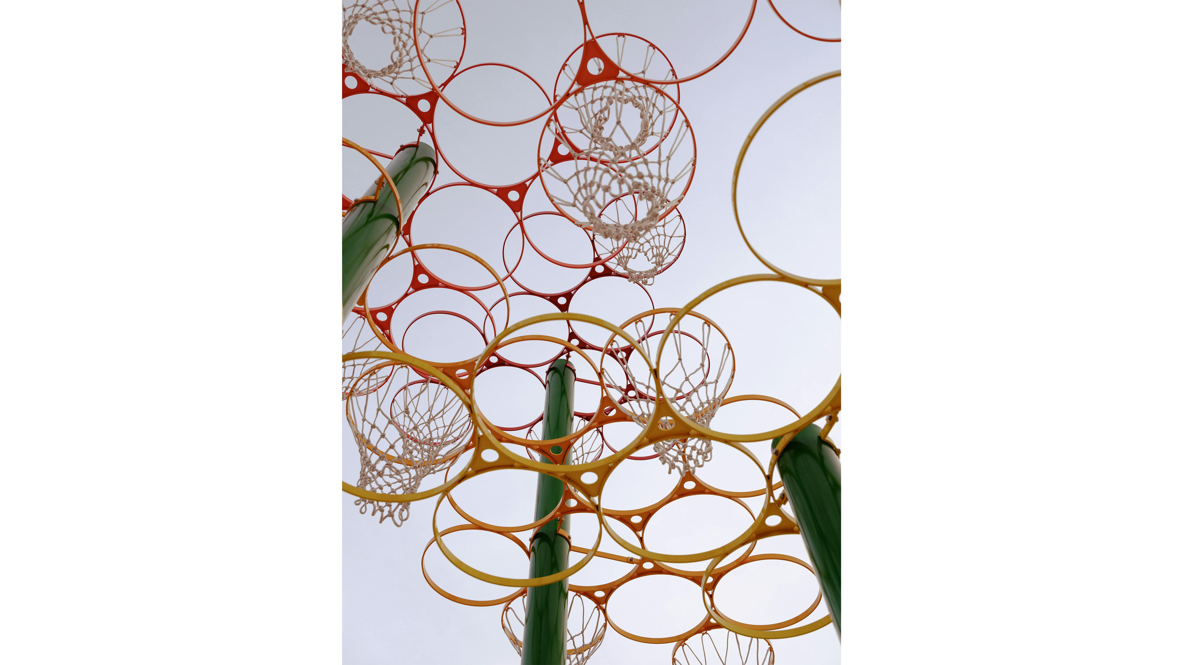 photo looking up at colorful multi hoop basketball structure