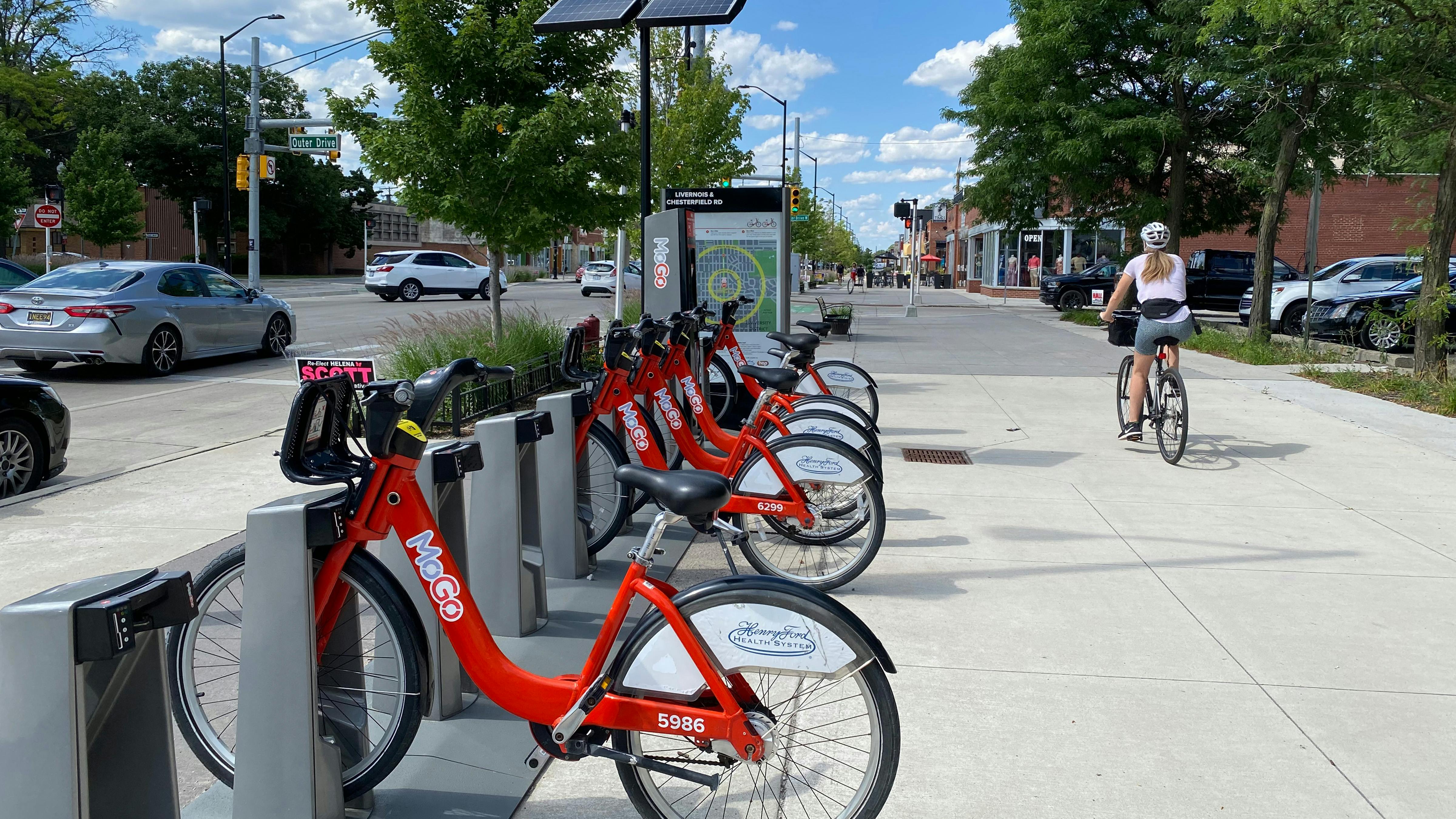 A photograph of MoGo rentable bikes installed along the transformed Livernois St at Chesterfield Rd.