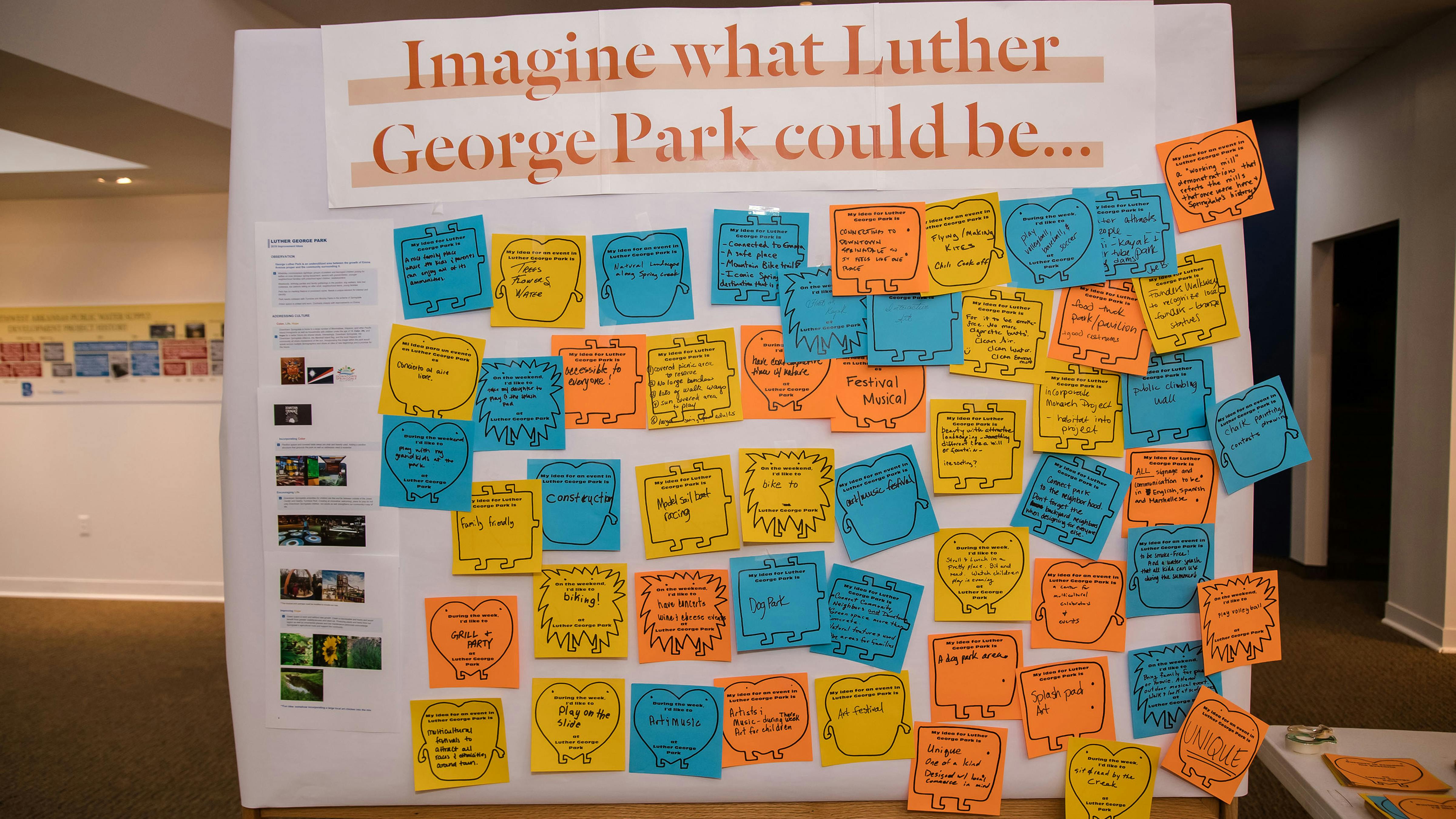 Photograph of panel filled with sticky notes from community, providing feedback of visions for what the park could be.